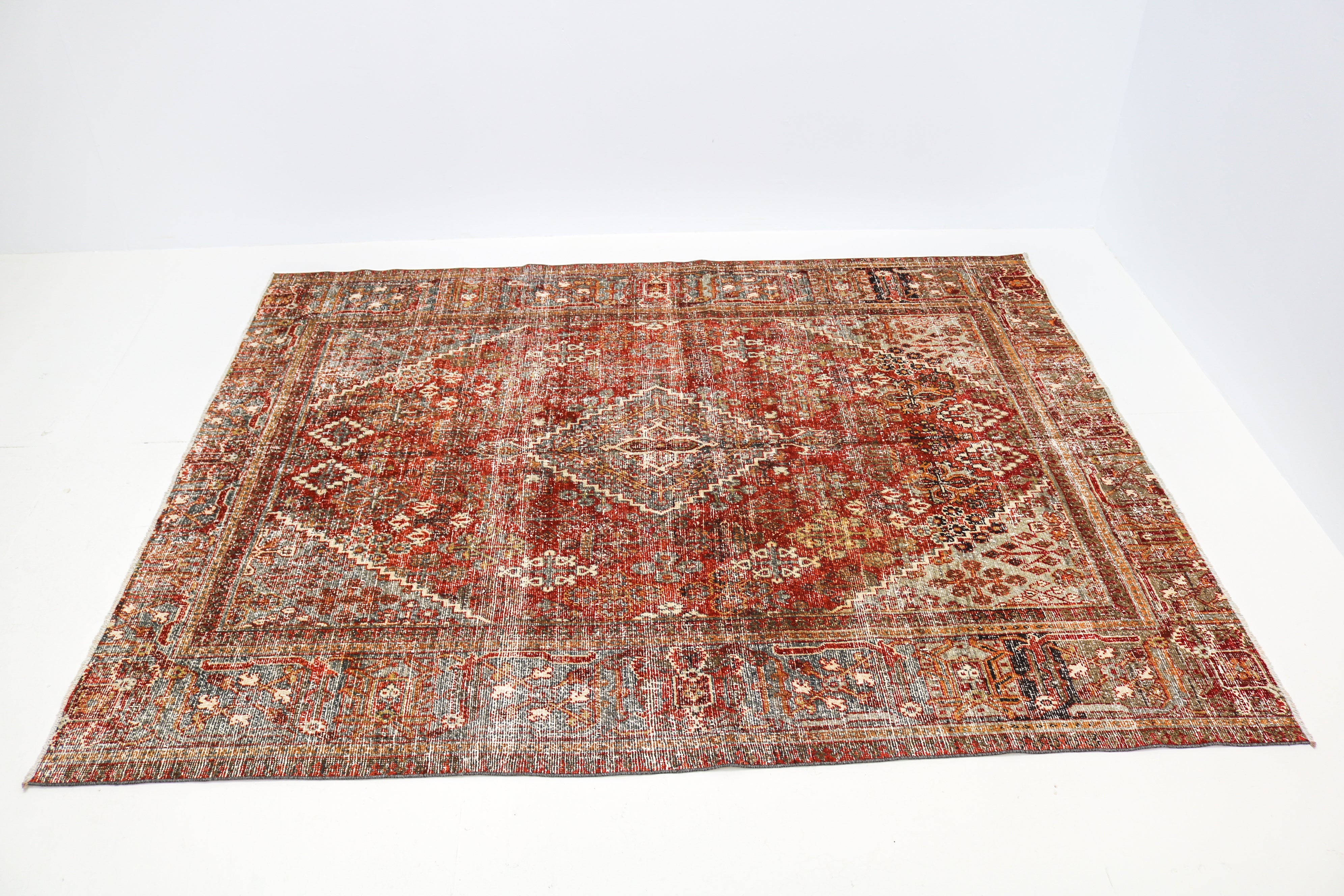 Hand-knotted antique Persian Josheqan rug with intricate geometric motifs and naturally aged colours