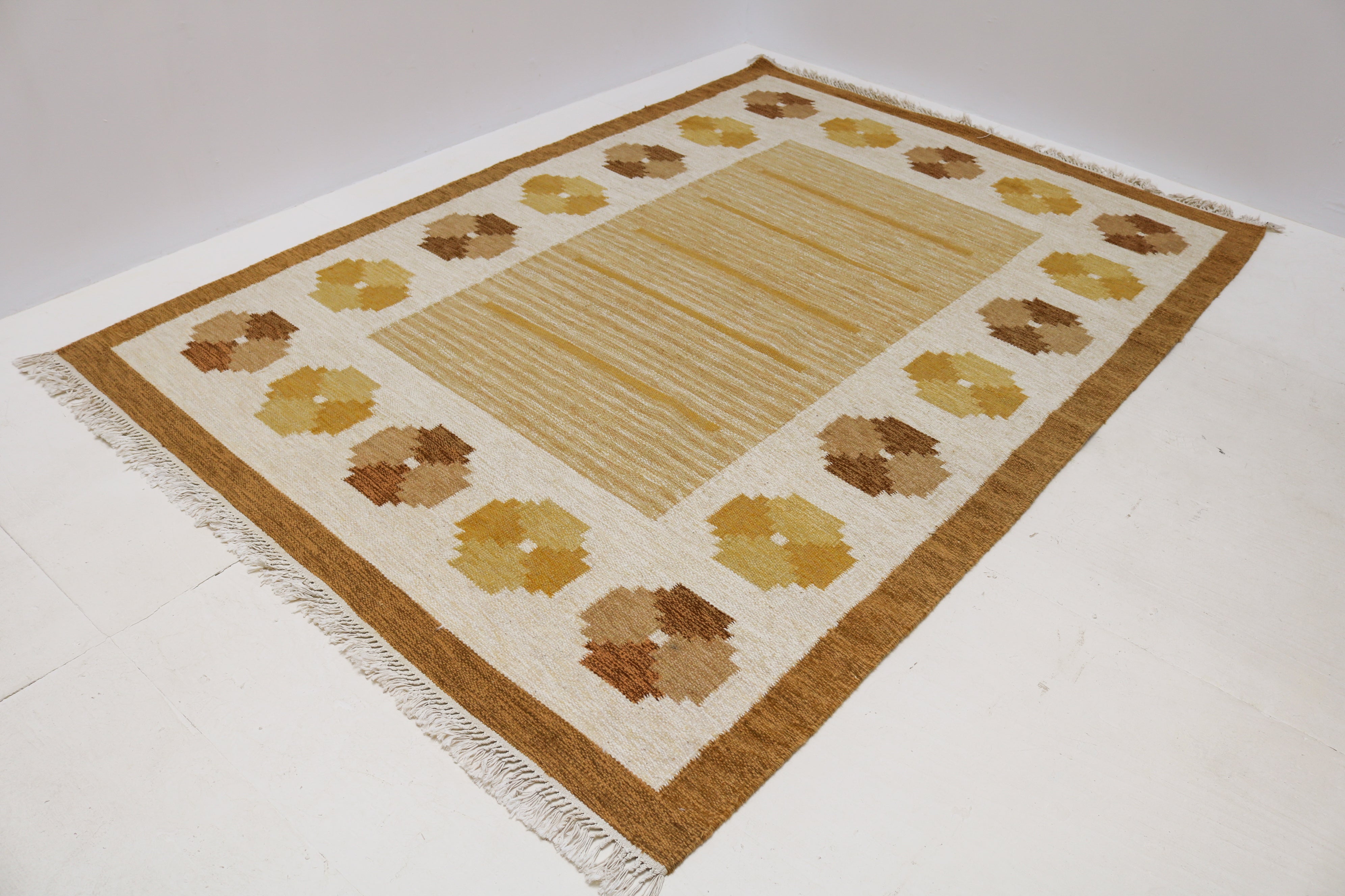 Vintage Swedish wool kilim with golden field and ivory geometric border