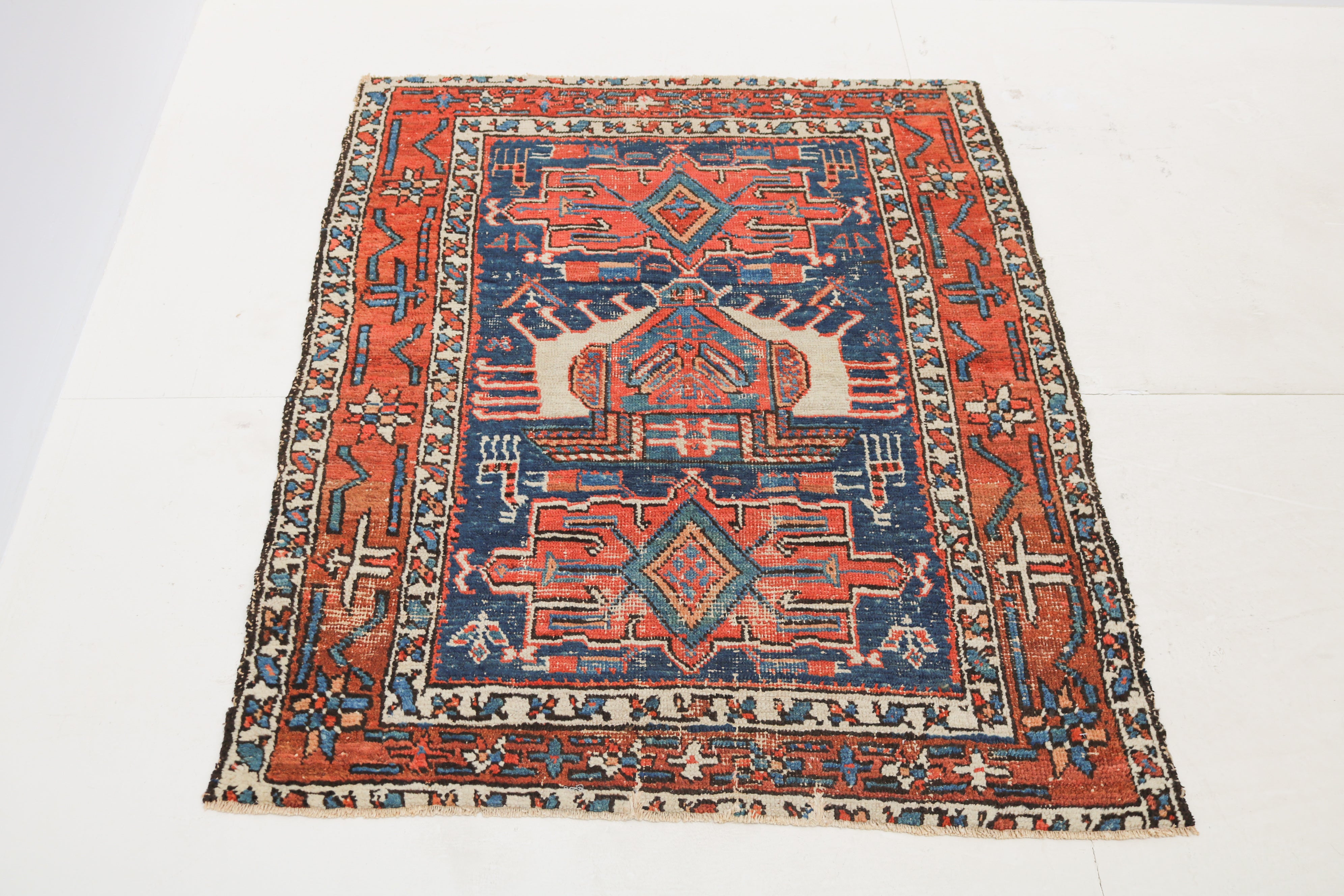 Hand-knotted antique Bakhshayesh rug 127 × 100 cm with rich blue and warm red colours