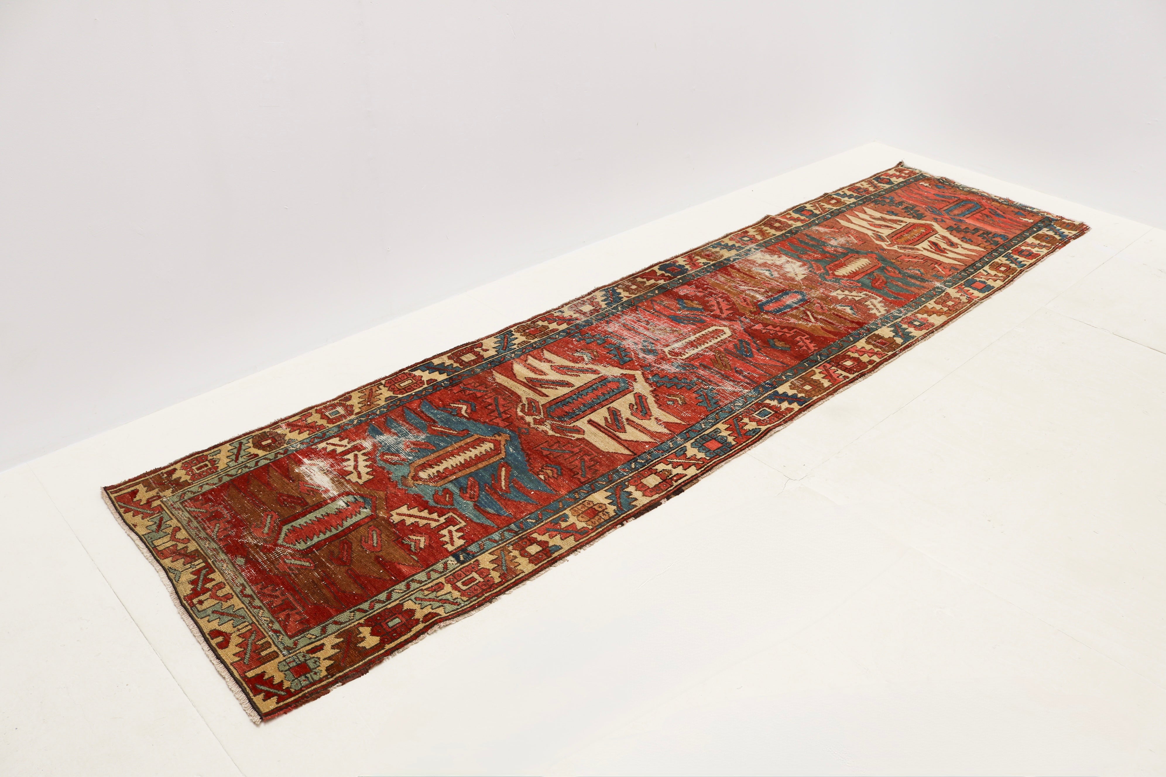 Late 19th century Bakhshayesh hallway runner with rich red, blue and terracotta colours