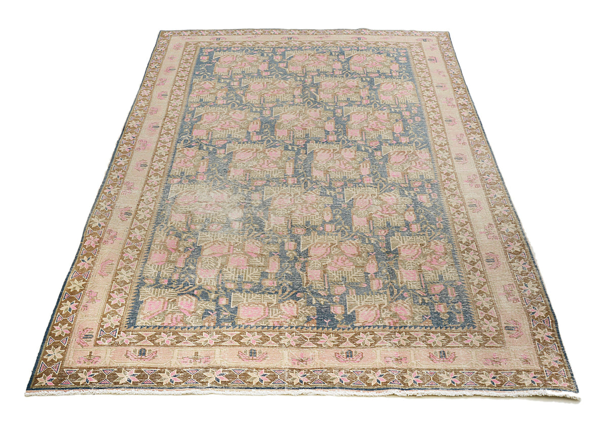 Full view of vintage Persian Afshar rug with geometric design and soft pastel tone