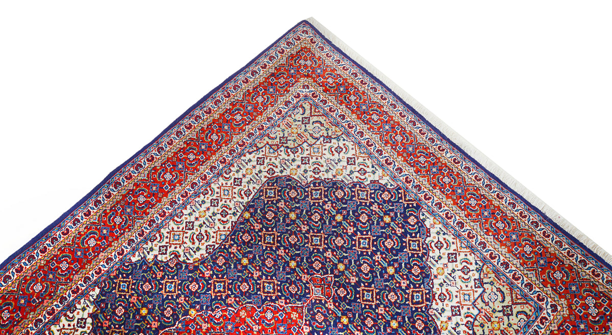 Close-up of Sarouk rug corner with intricate floral and geometric motifs