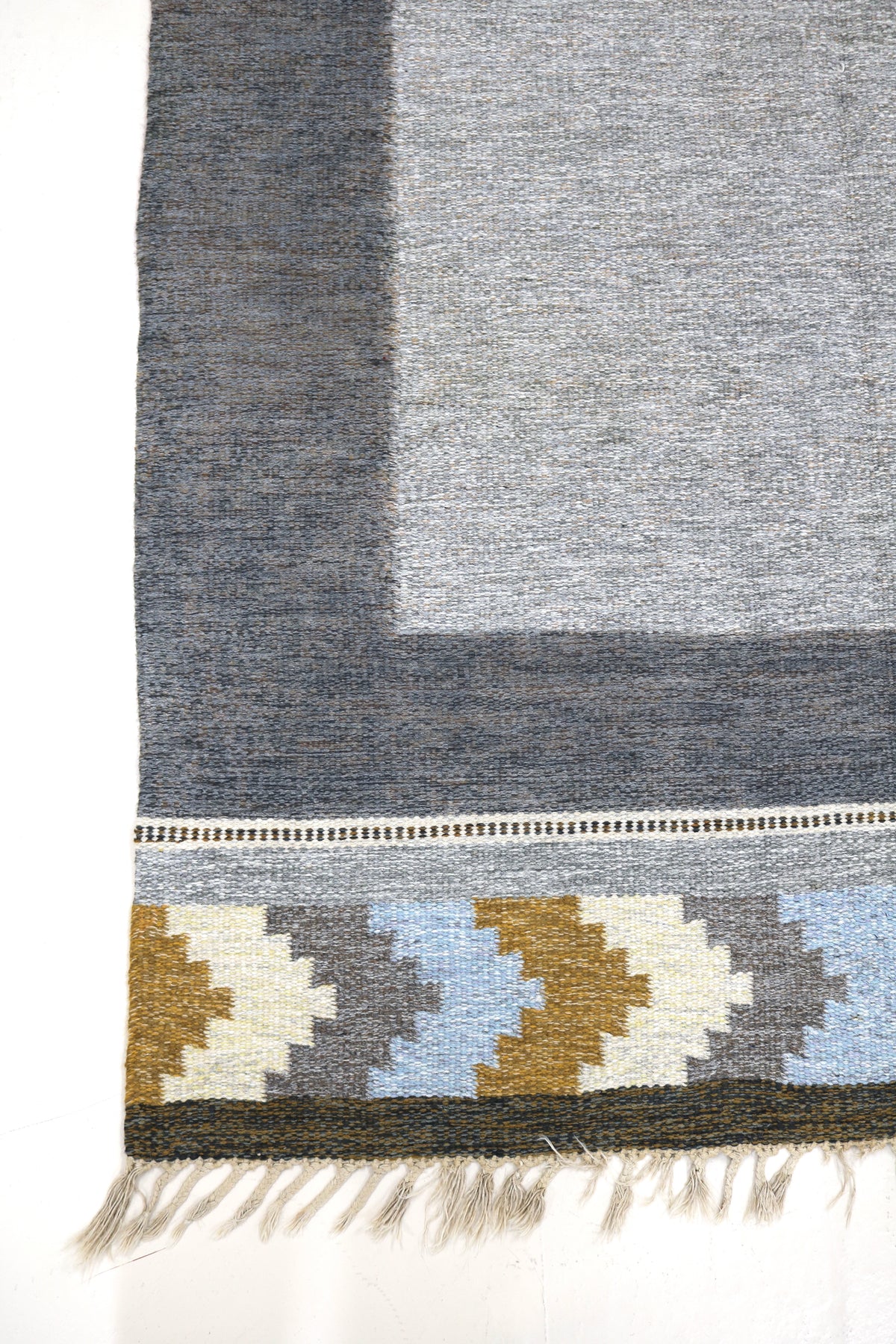 Vintage Swedish Kilim rug with grey field, charcoal border and geometric ochre and blue motifs