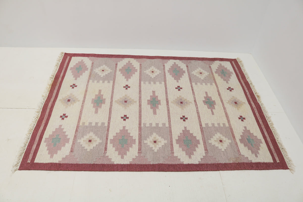 Vintage Swedish Kilim rug showcasing horizontal geometric bands in soft Scandinavian colours