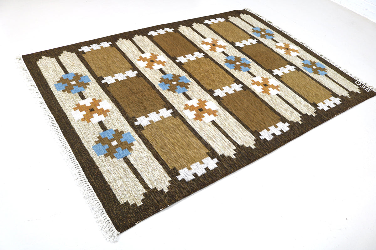 Full view of vintage Swedish Kilim rug with horizontal bands and repeating geometric patterns