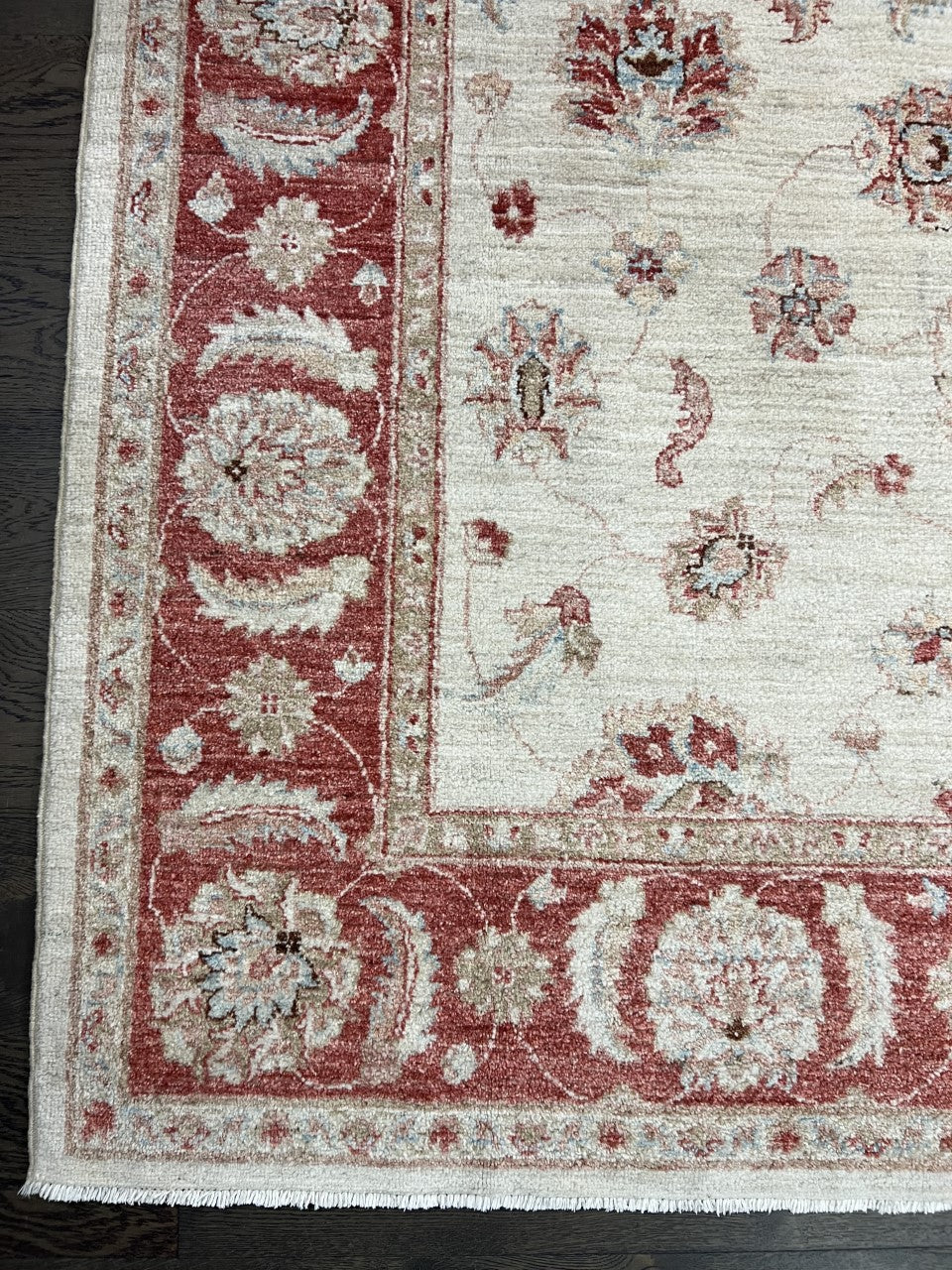 Afghan Ziegler rug with ivory field, red floral border and delicate scattered motifs