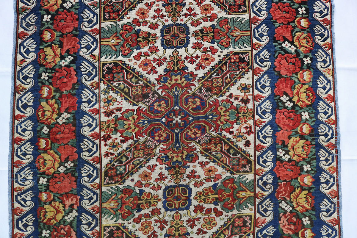 Detailed section of Zeichur runner with symmetrical geometric and floral patterns