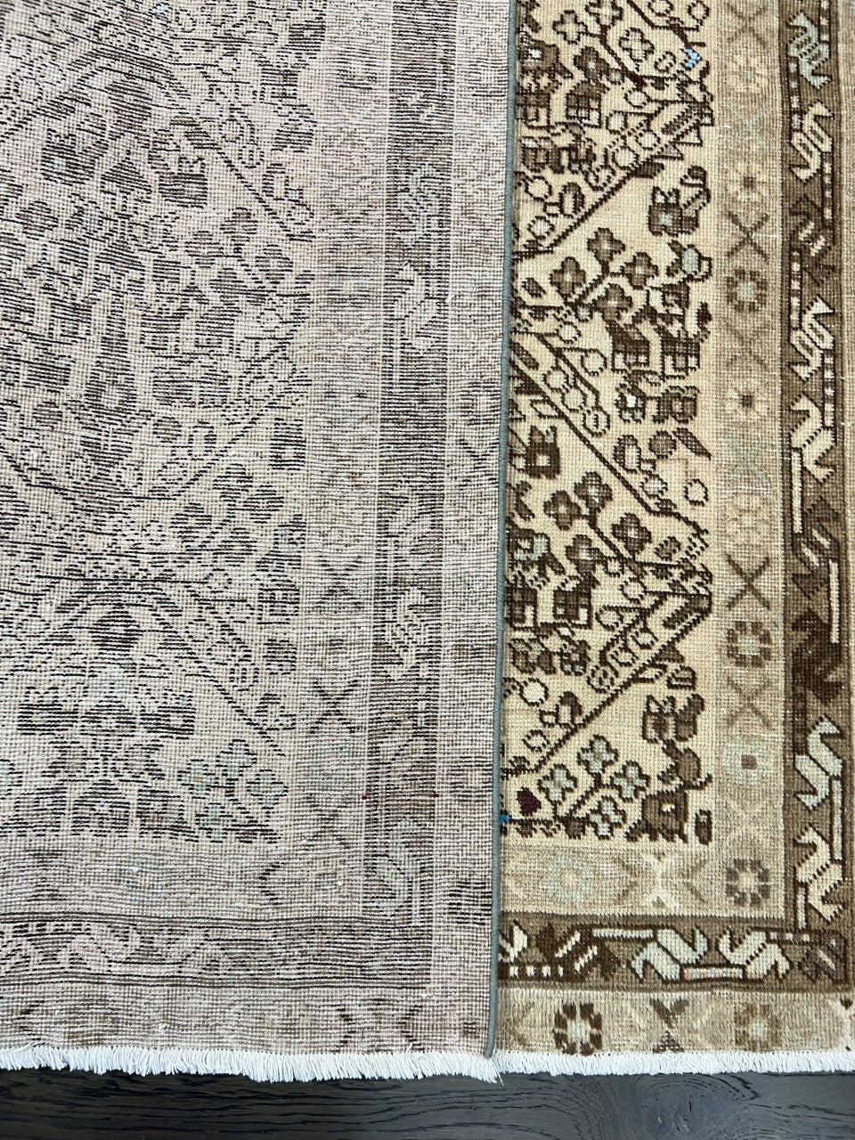 Folded Afshar rug showing patterned reverse and detailed woven border