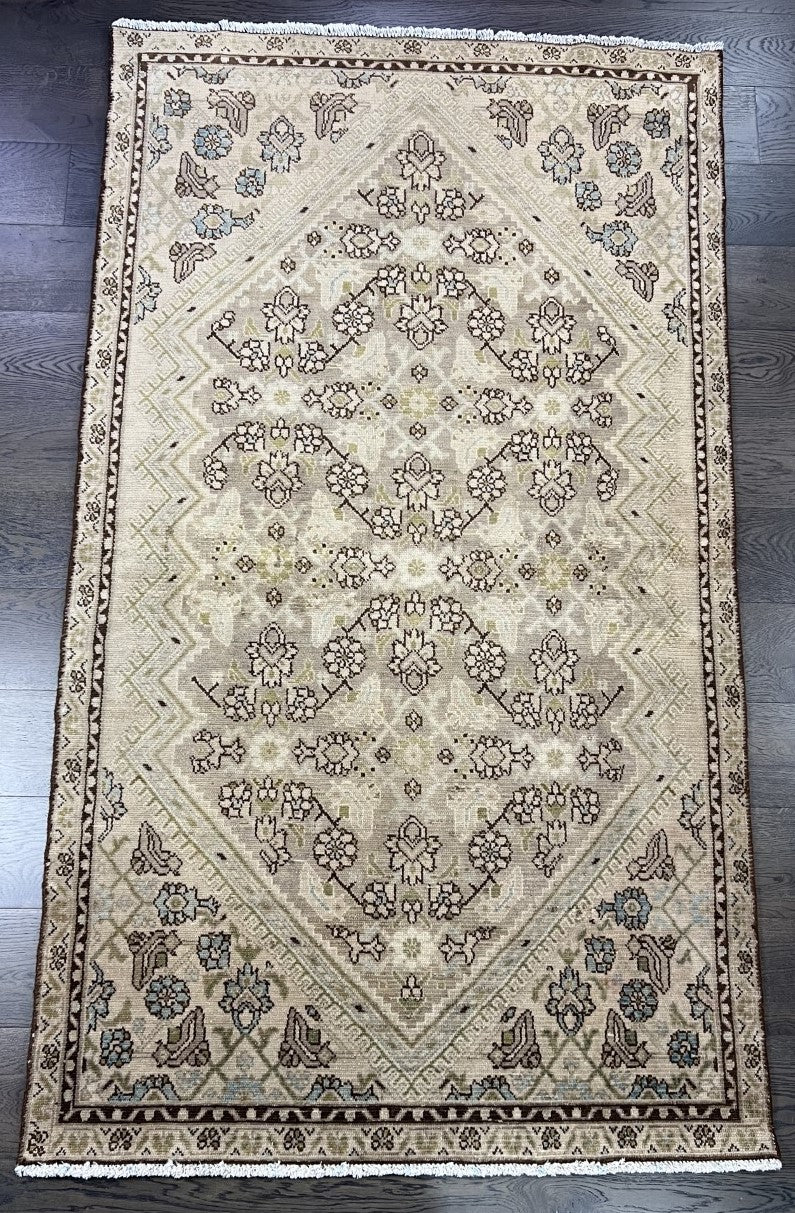 Full Malayer rug showing central medallion surrounded by repeating floral patterns