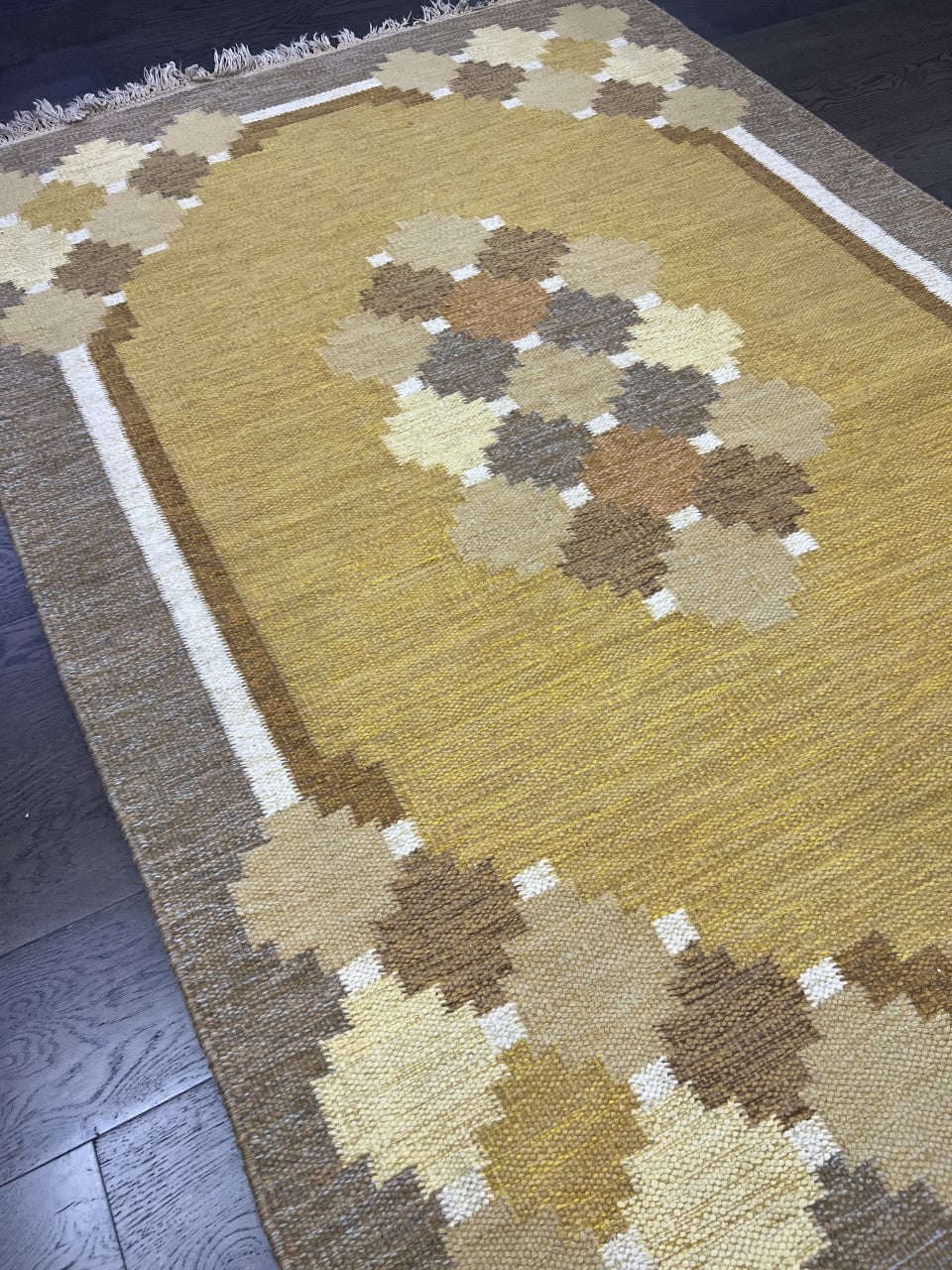 Angled view of Swedish Kilim highlighting flat-woven texture and diamond motifs