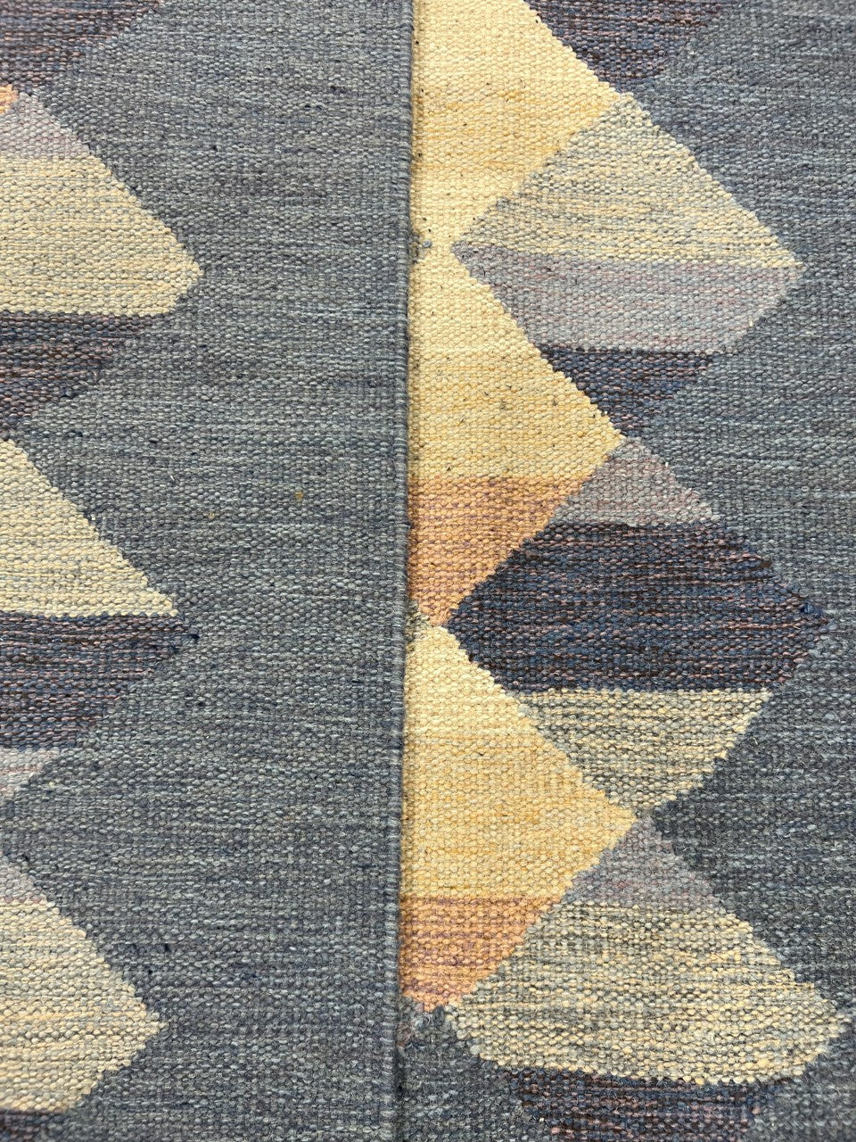 Folded Kilim showing patterned reverse and flat-woven geometric design