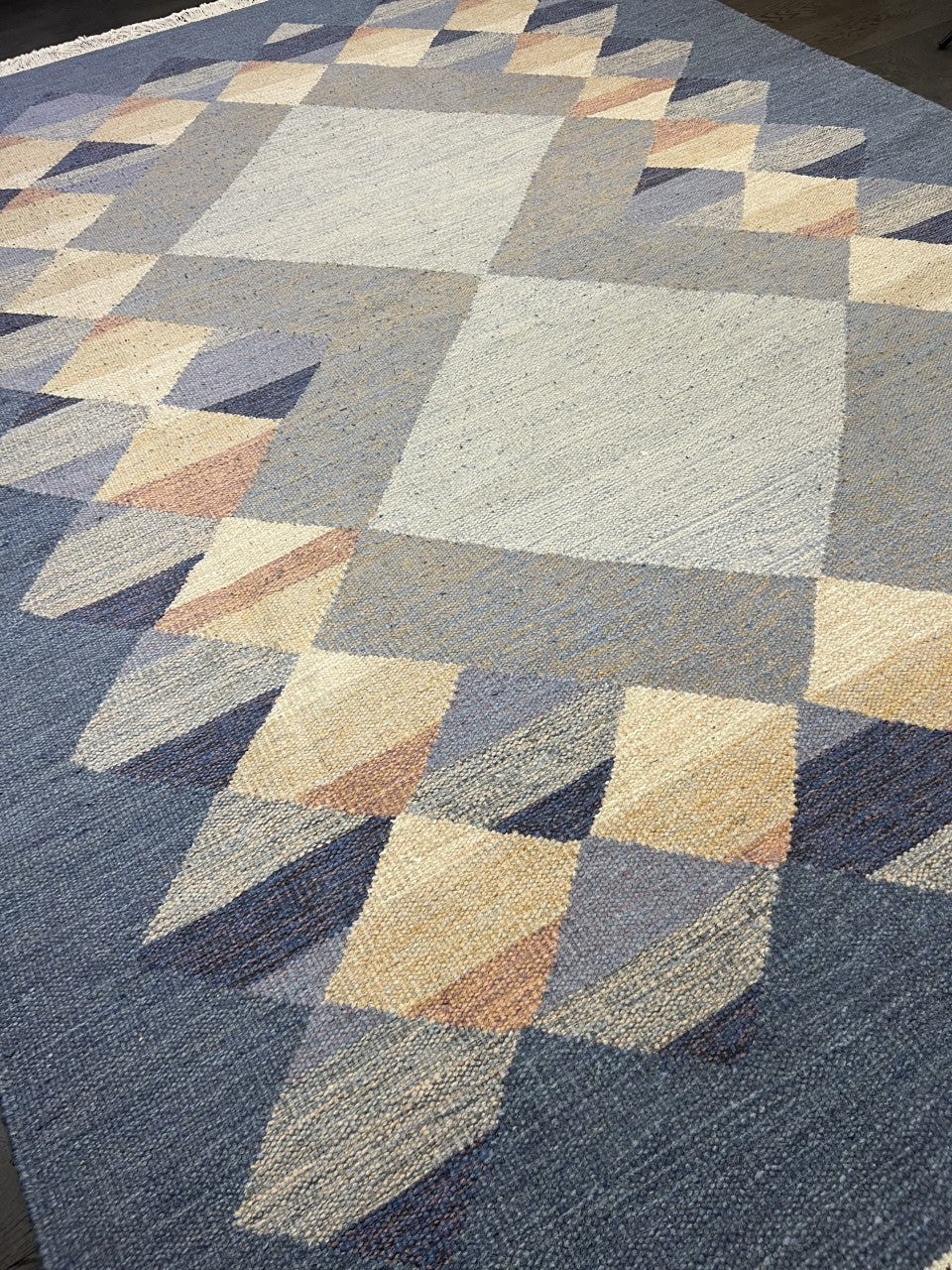 Detailed Kilim field featuring interlocking diamond shapes in muted natural tones