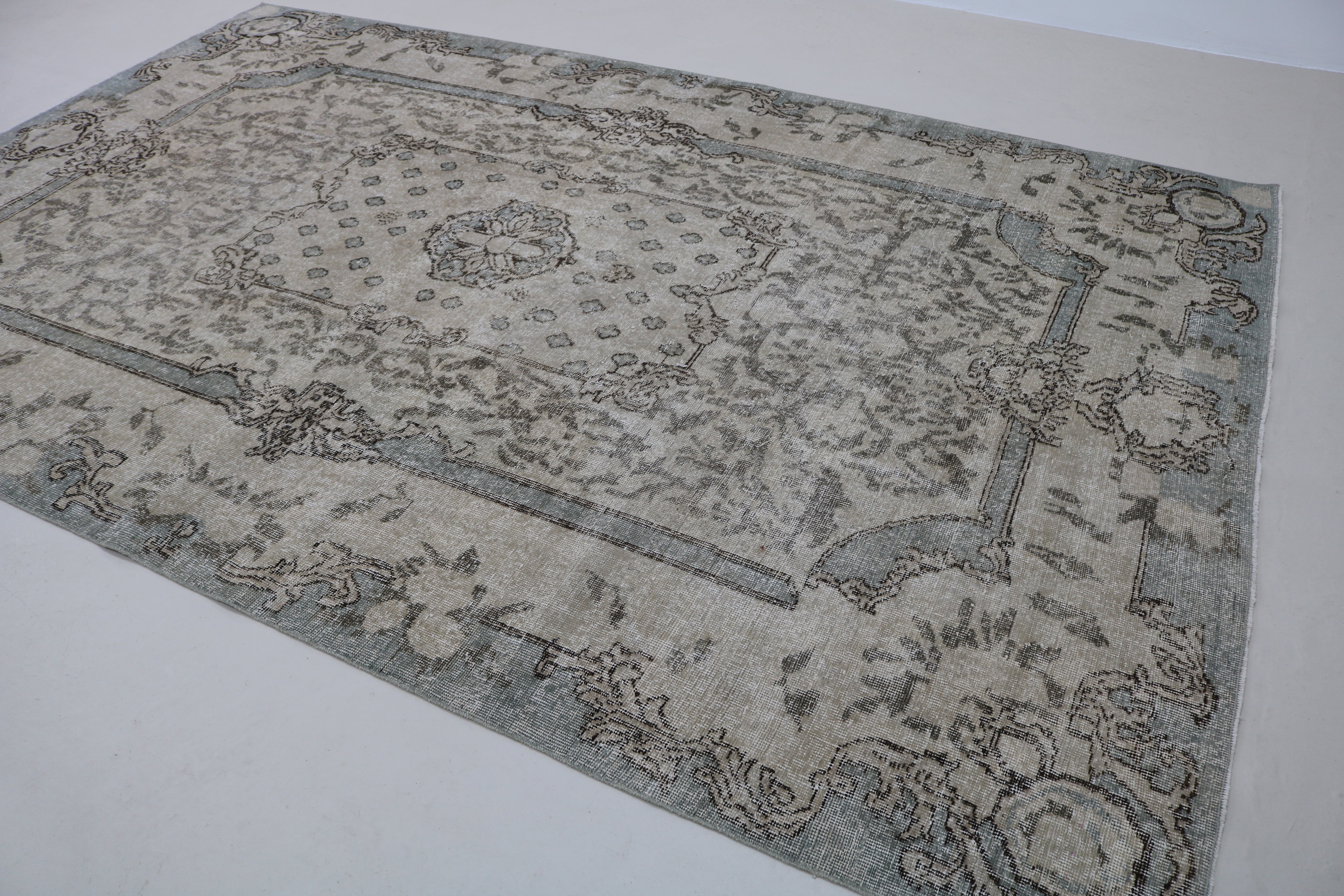 Close-up of hand-woven wool texture on vintage Turkish Sparta rug
