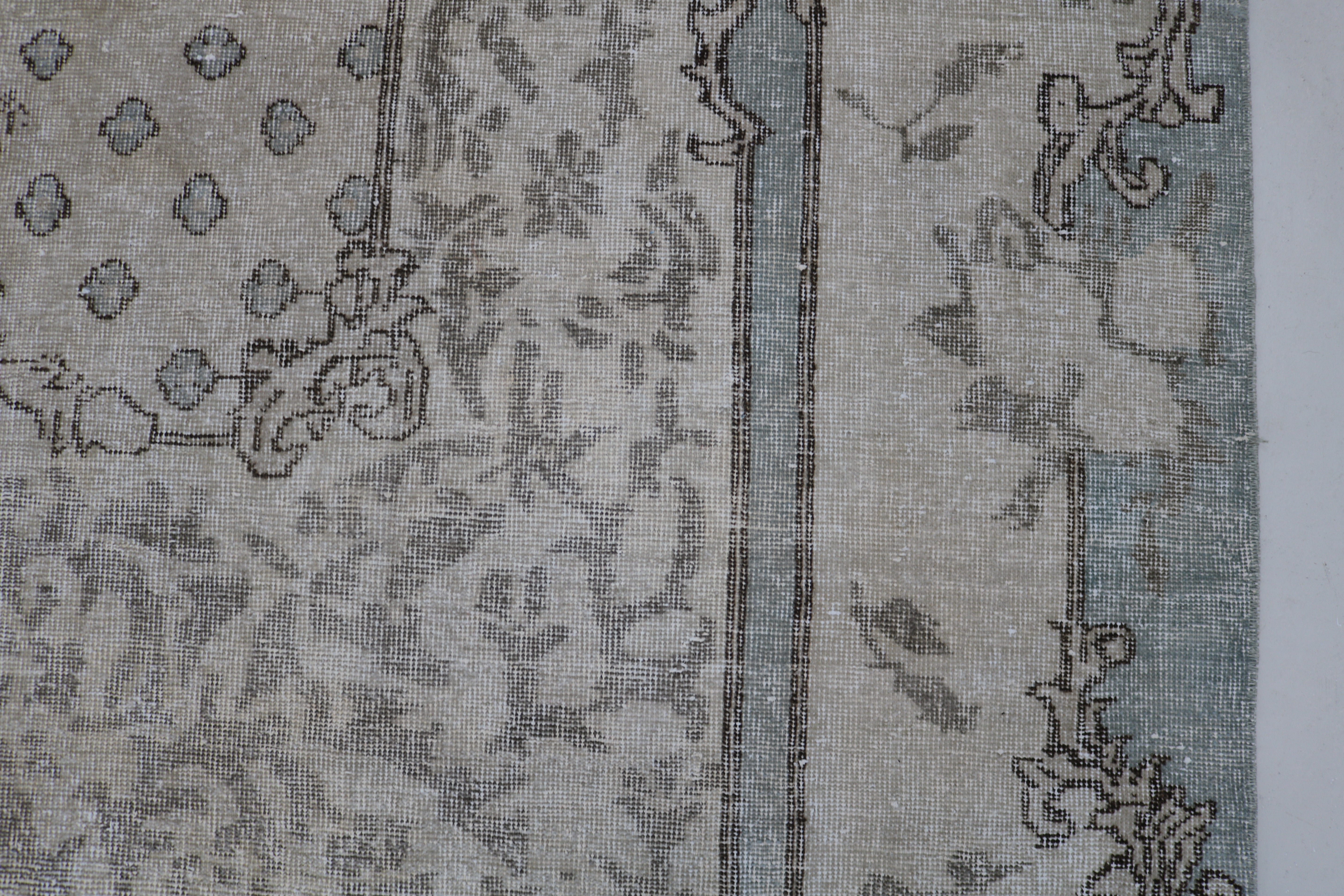 Close-up of hand-woven wool texture on vintage Turkish Sparta rug
