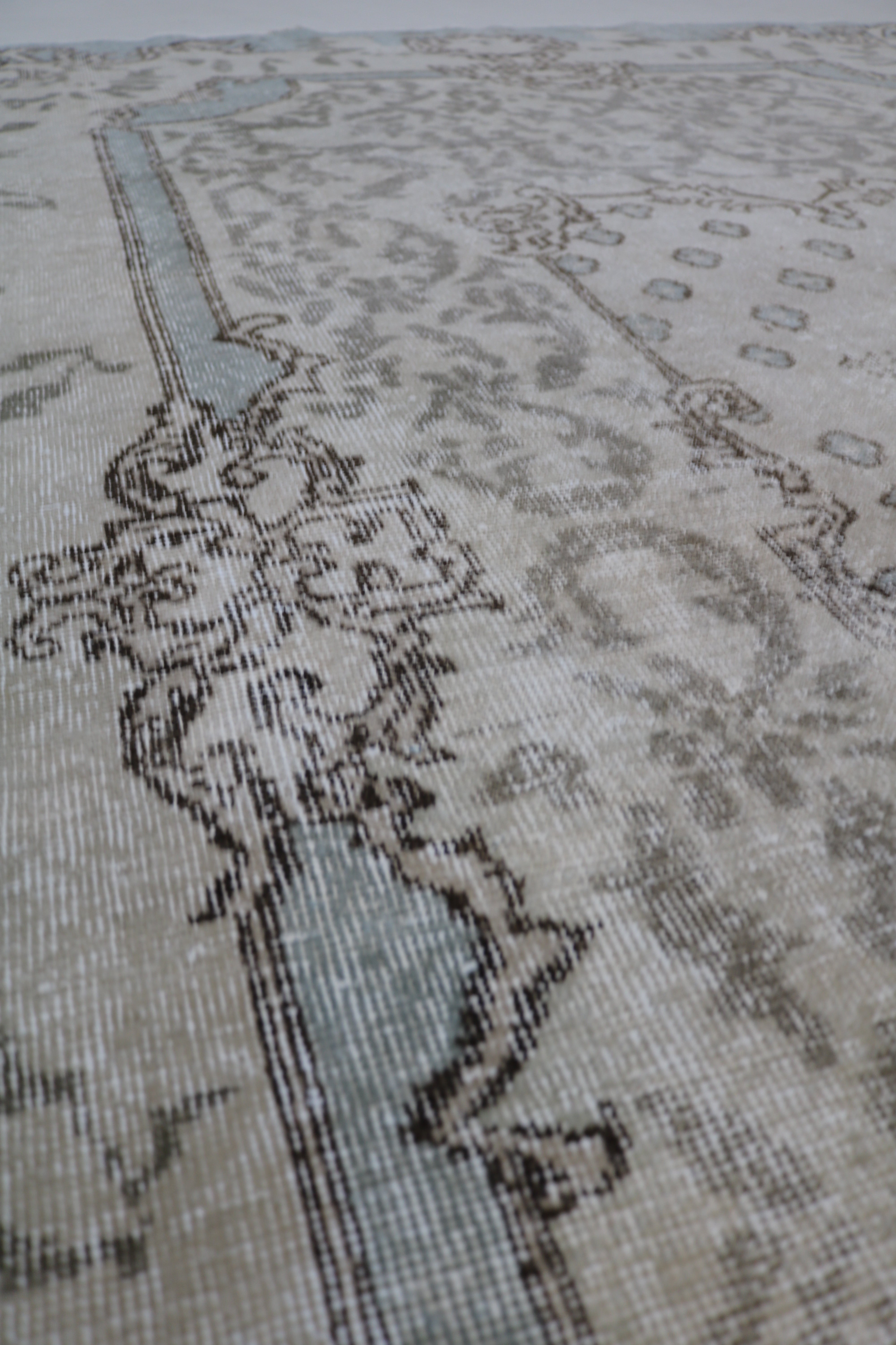 Close-up of hand-woven wool texture on vintage Turkish Sparta rug
