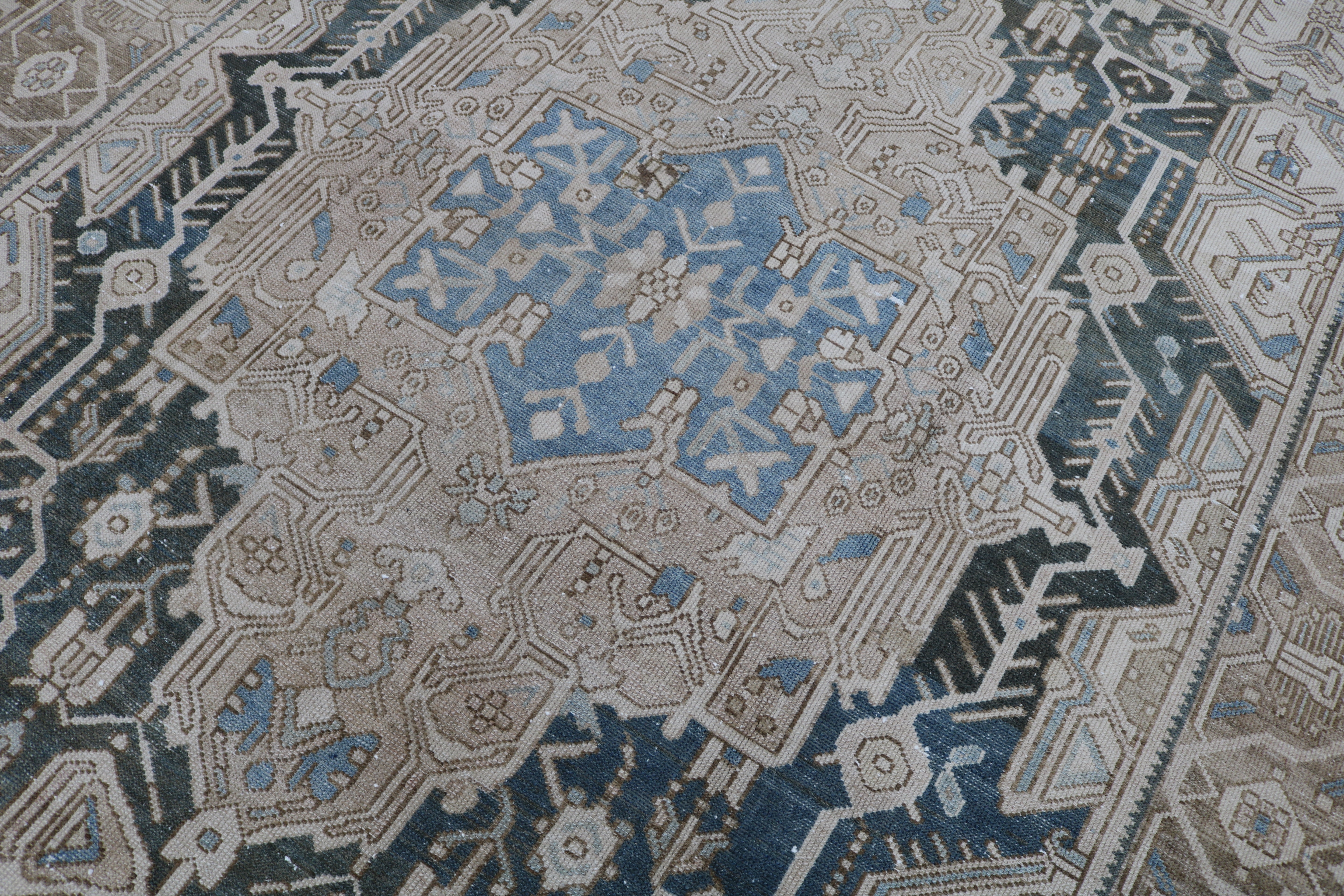 Close-up of hand-knotted wool texture on antique Persian Karaja carpet
