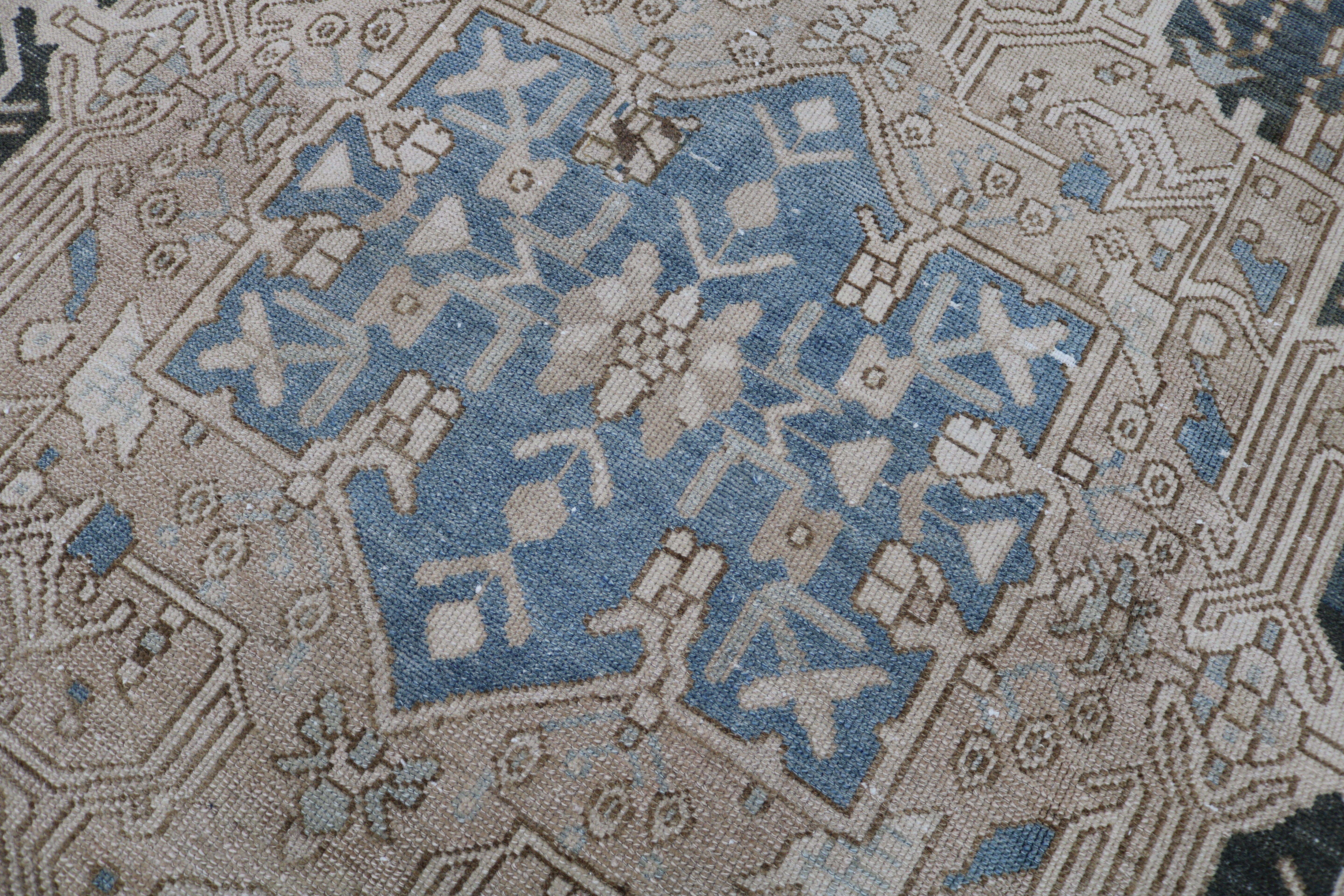 Close-up of hand-knotted wool texture on antique Persian Karaja carpet
