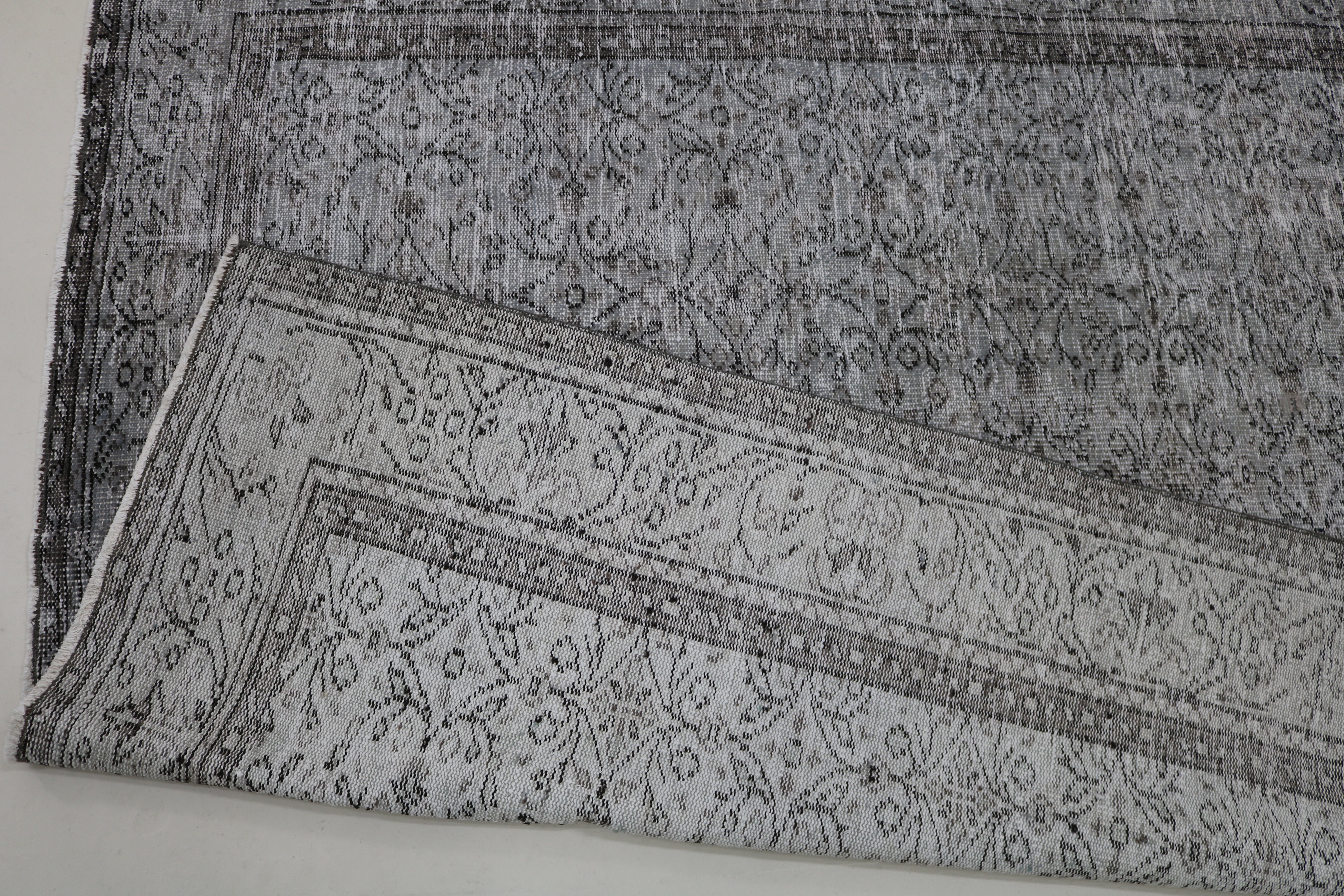 Close-up of hand-woven wool texture on vintage Turkish Sparta rug
