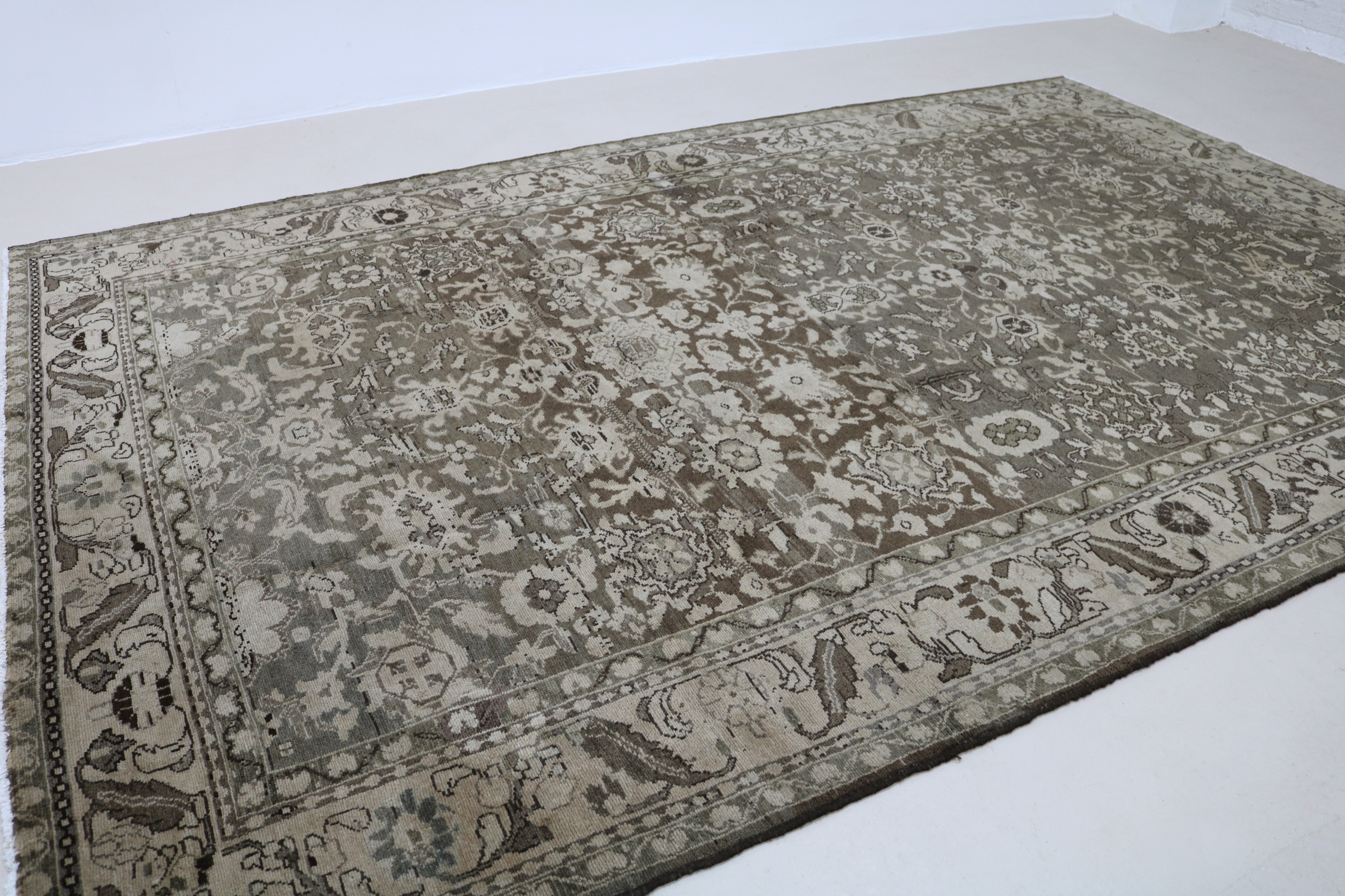 Close-up of hand-knotted wool texture on Persian Malayer carpet
