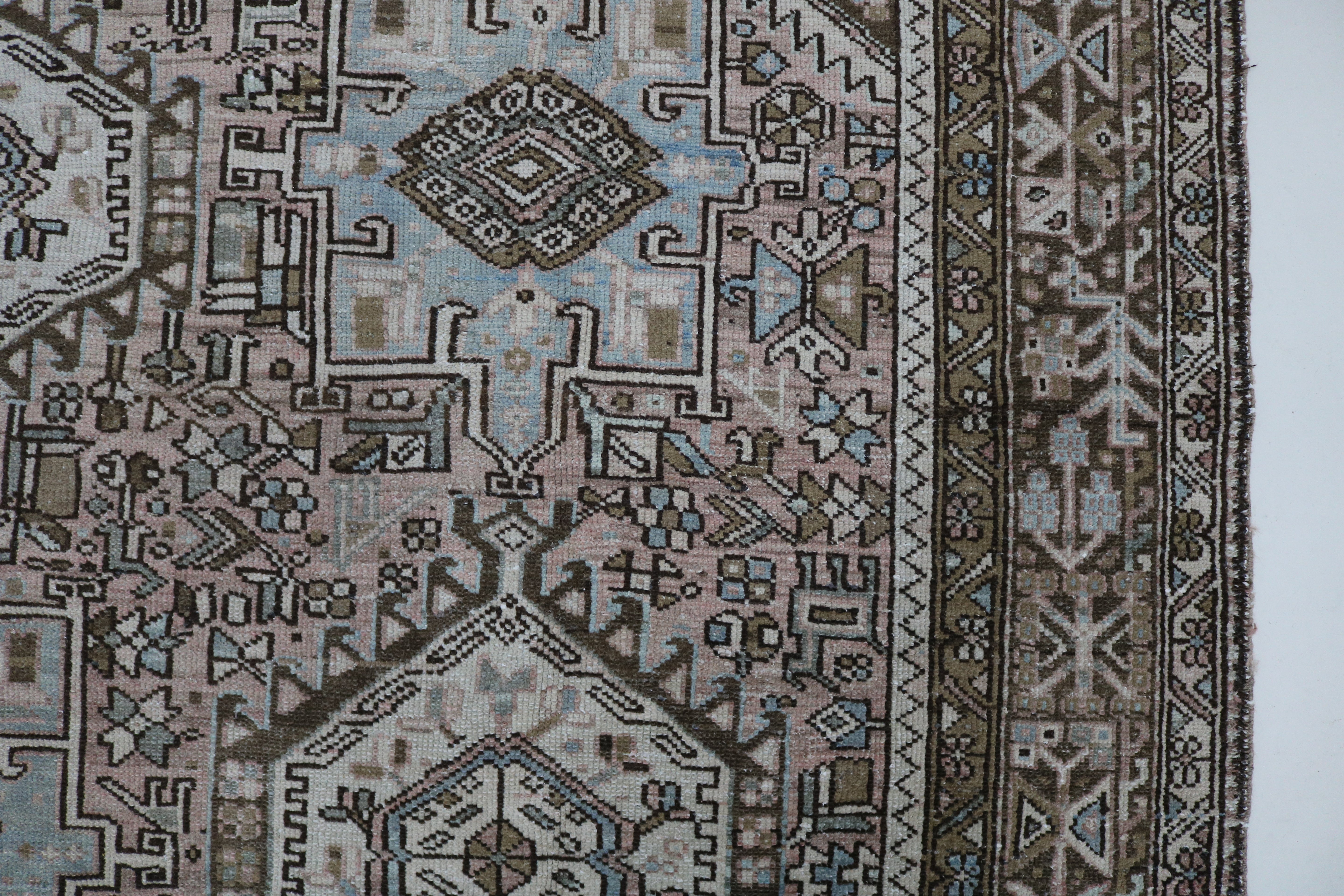 Close-up of hand-knotted wool texture on antique Persian Heriz–Karaja carpet

