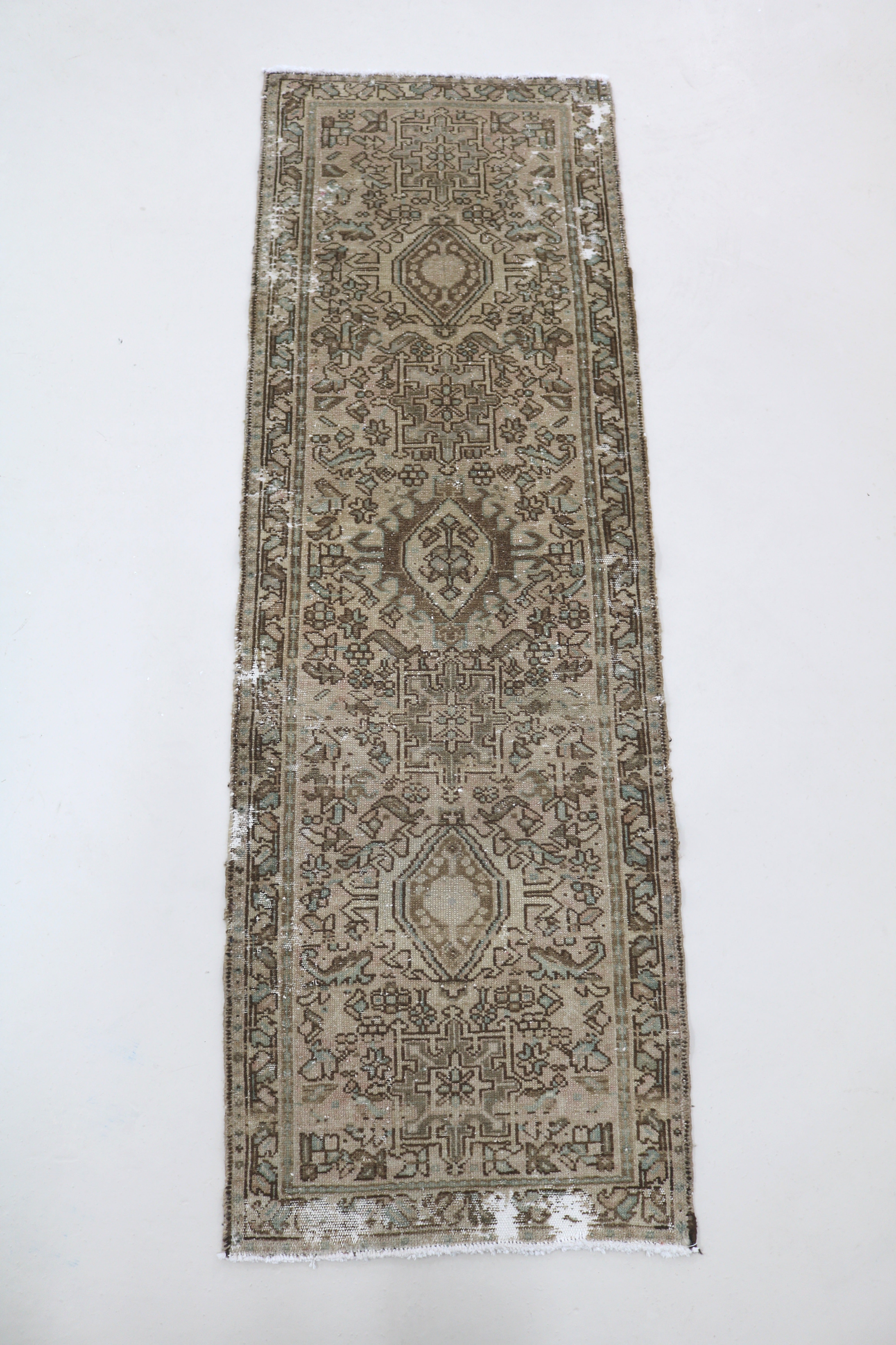 Full view of antique Persian Heriz runner with traditional geometric design
