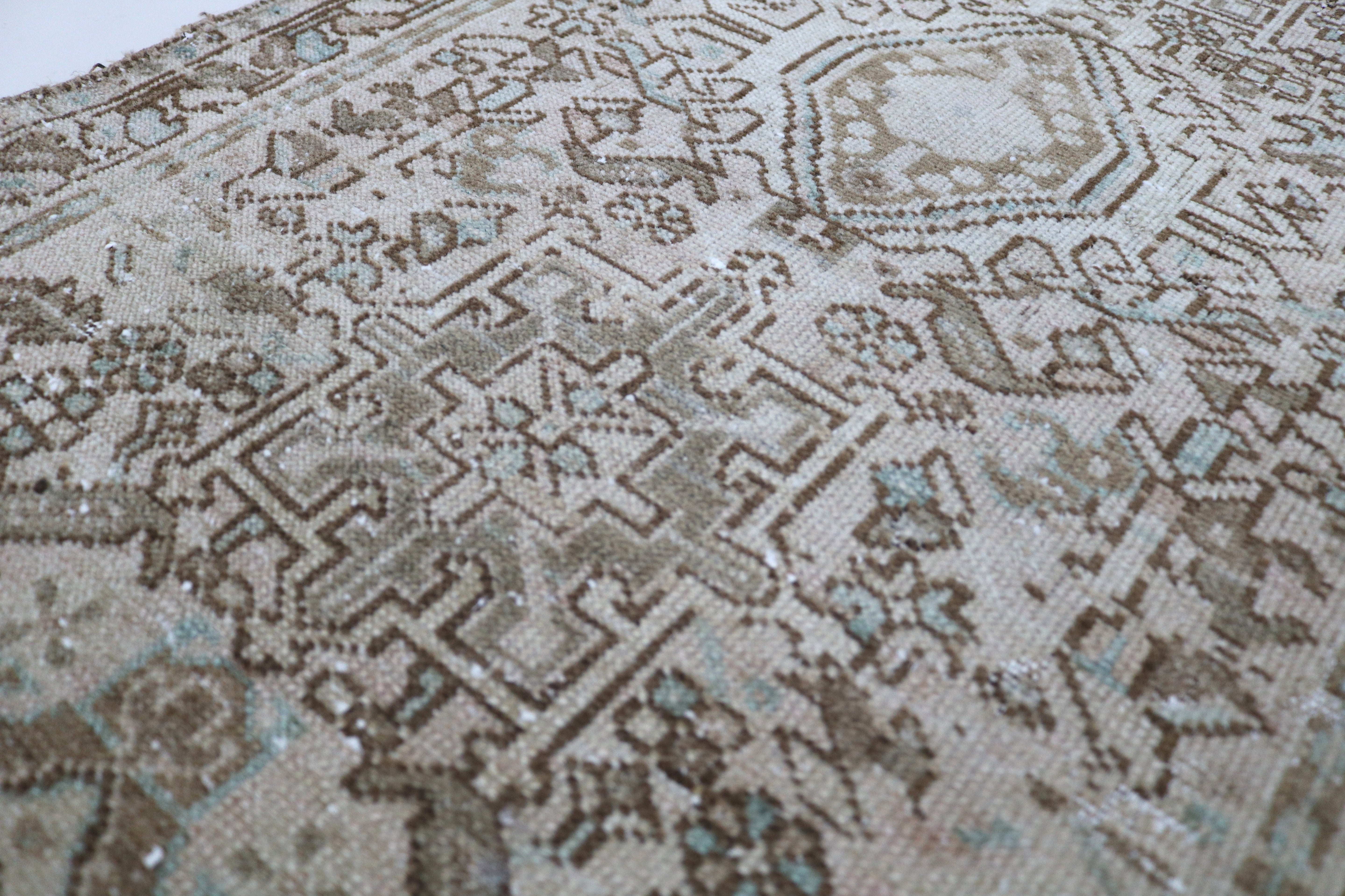 Close-up of hand-knotted wool texture on antique Persian Heriz runner
