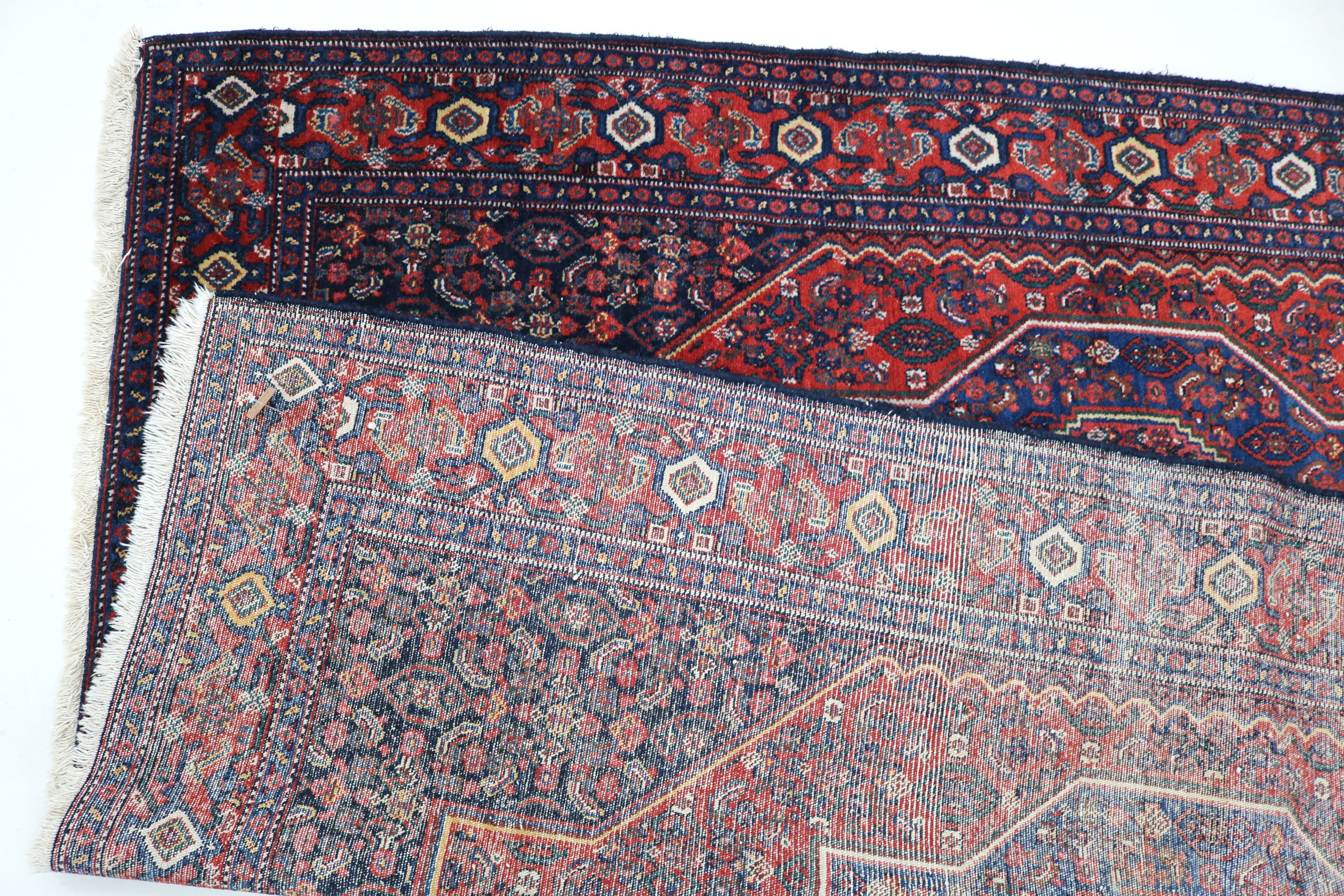 Close-up of backside on antique Persian Senneh rug
