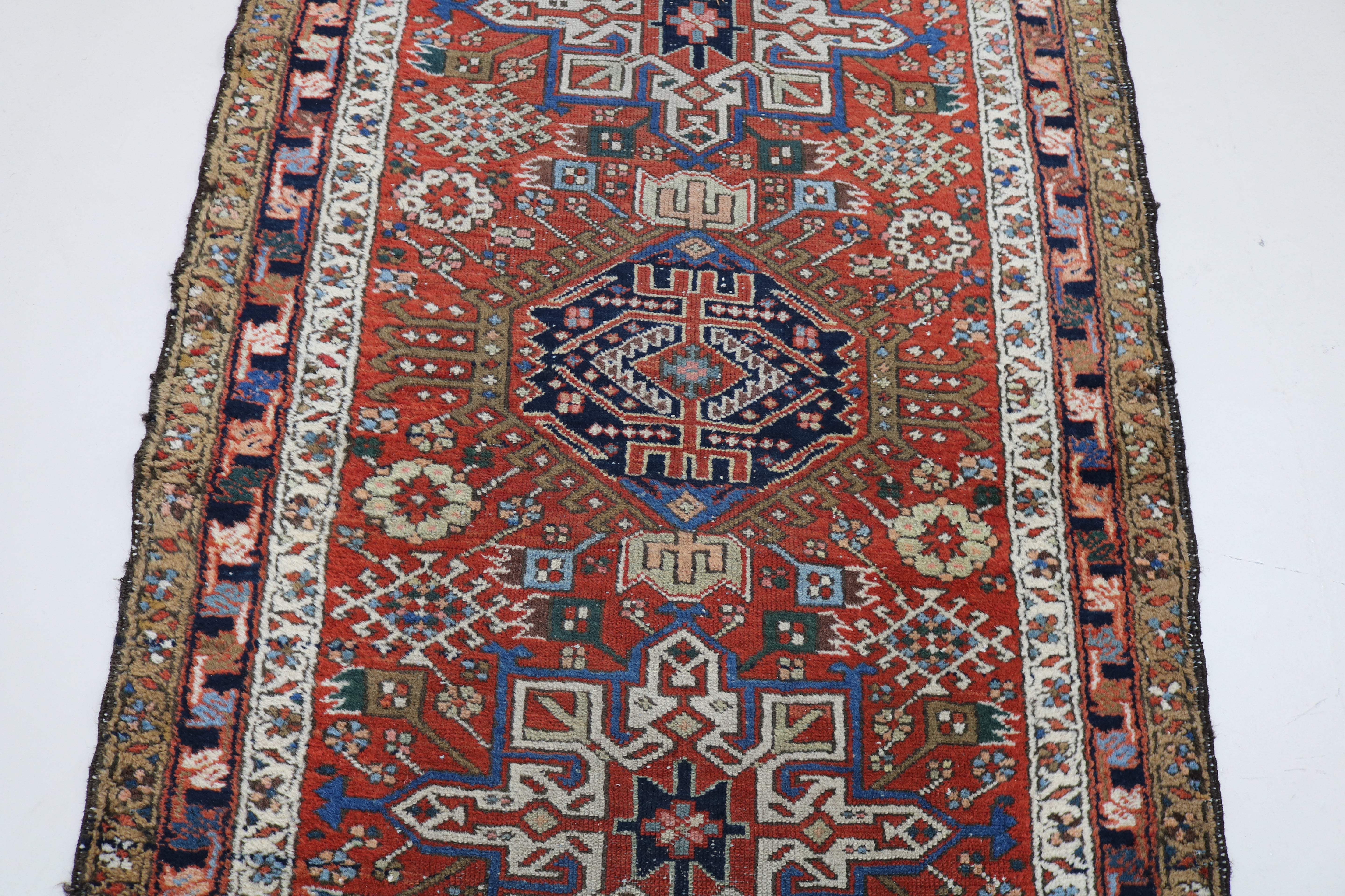 Close-up of traditional border pattern on antique Persian Karaja runner
