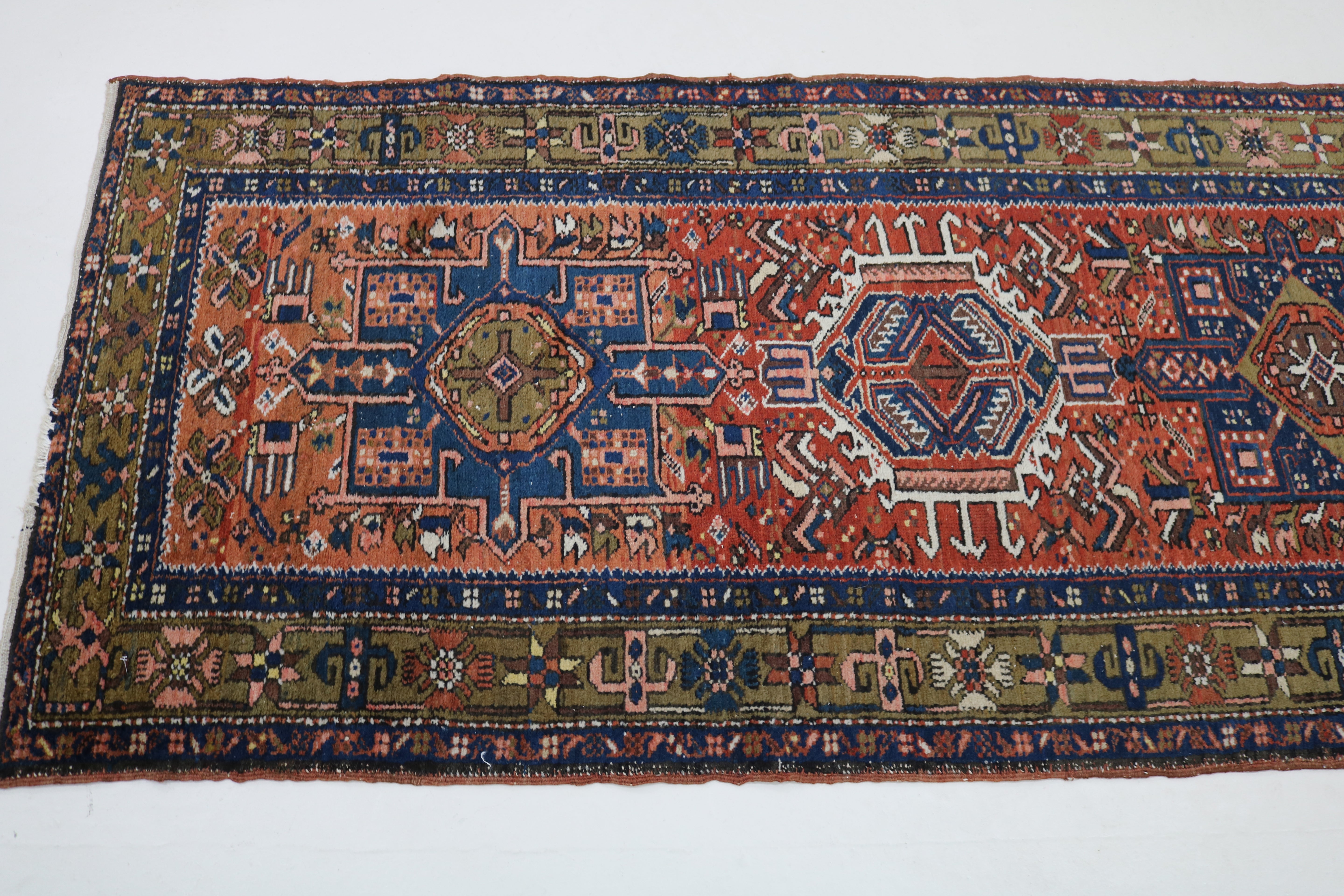 Close-up of geometric field motifs on antique Persian Karaja runner
