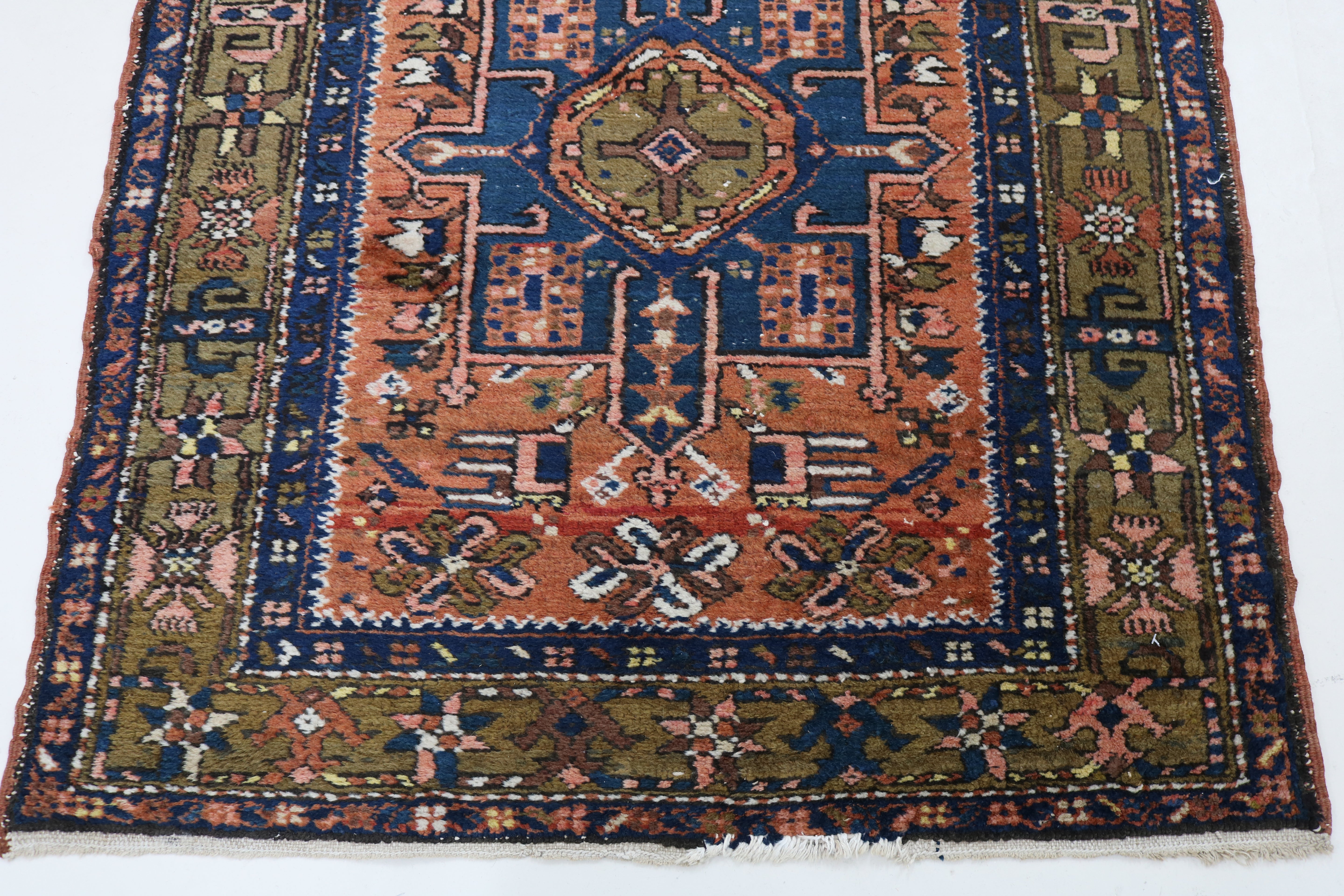 Close-up of traditional border pattern on antique Persian Karaja runner
