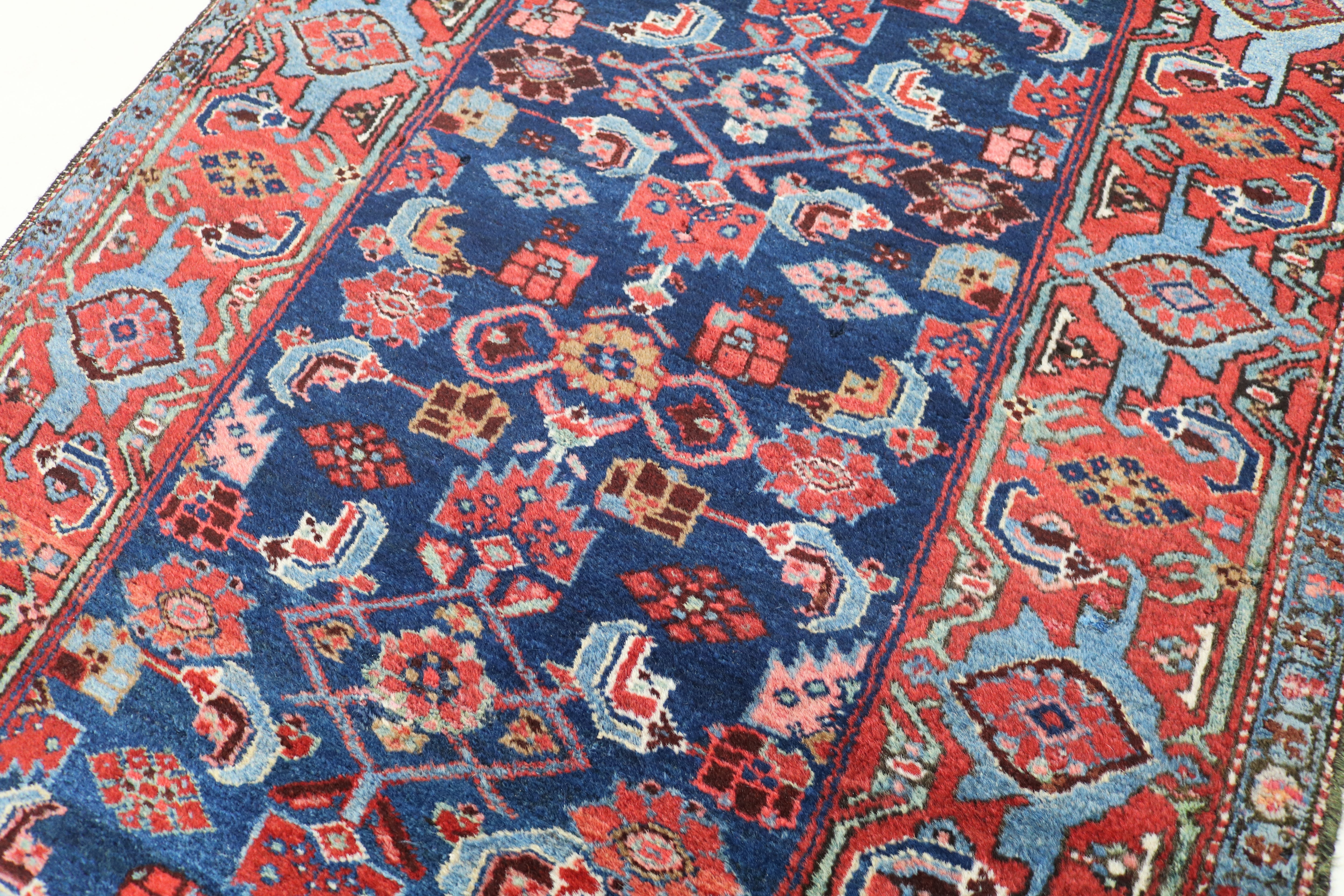 Close-up showing rich colours and fine drawing on antique Persian Malayer runner
