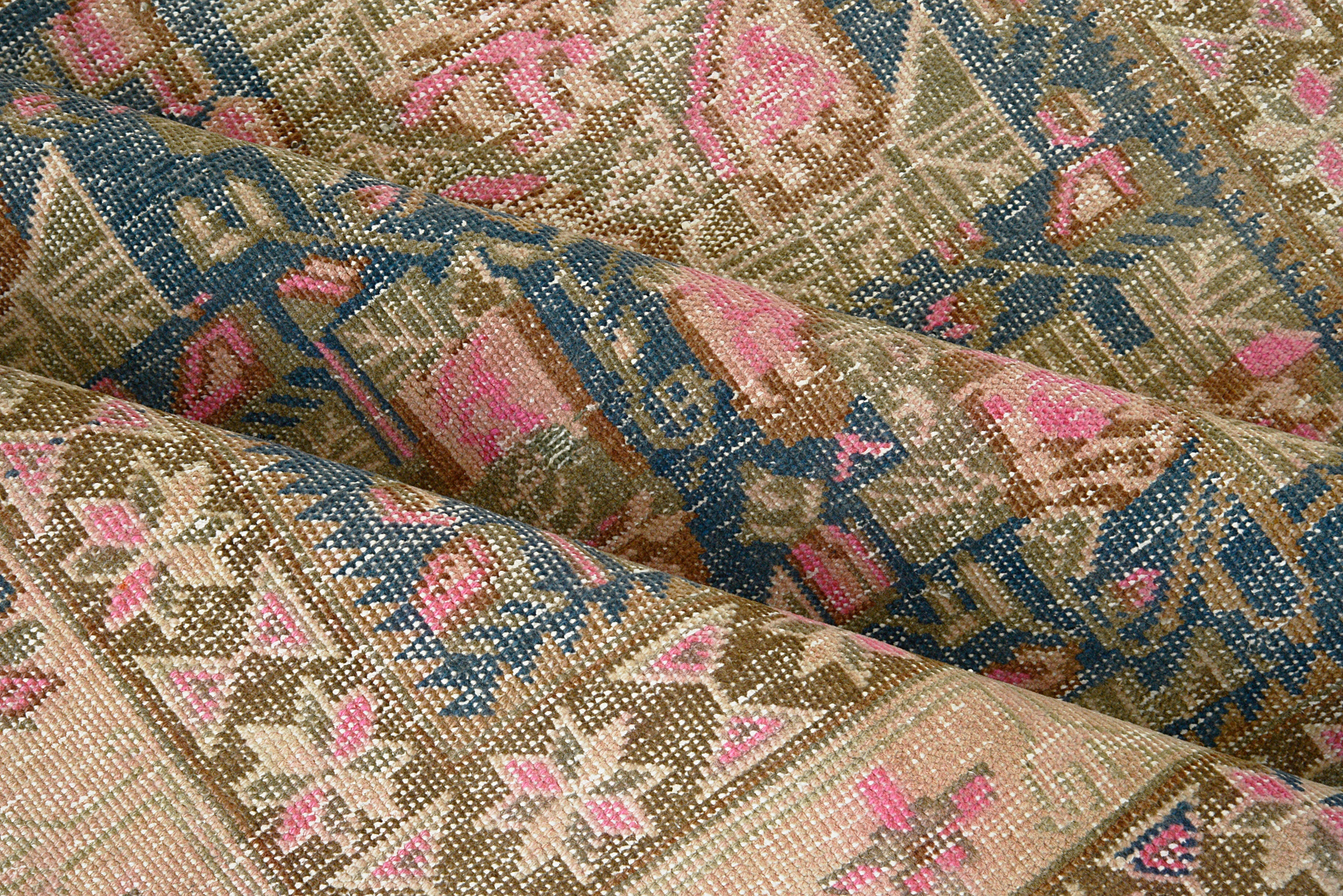 Close-up details of vintage Persian Afshar rug showing wool texture, borders, and natural patina
