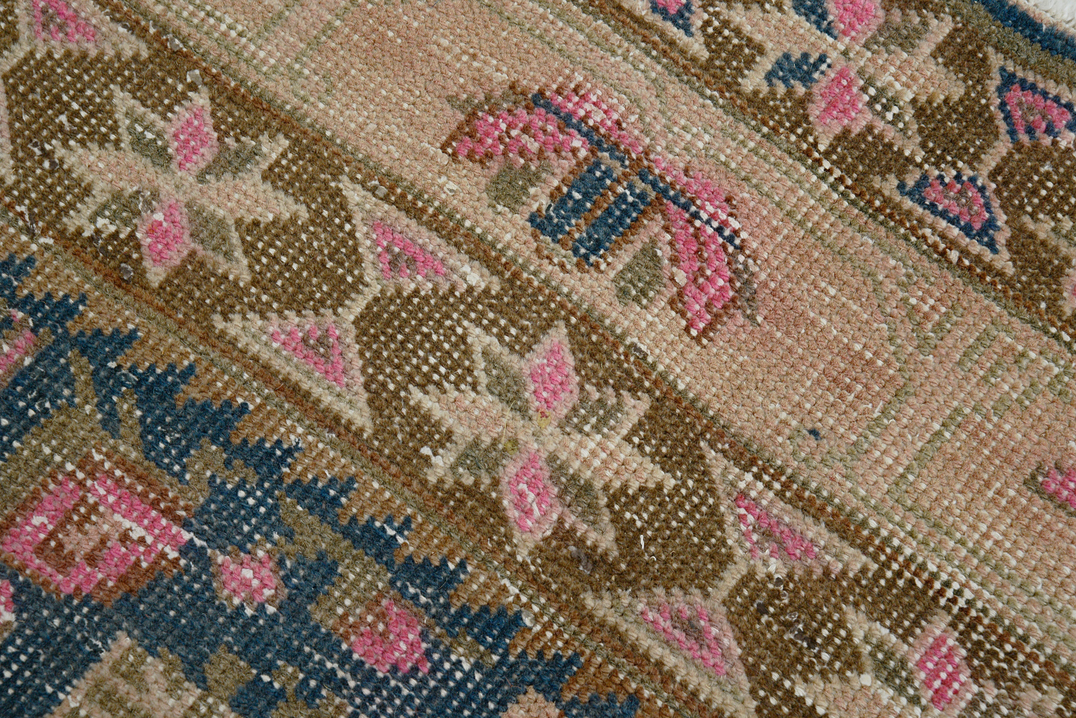 Close-up details of vintage Persian Afshar rug showing wool texture, borders, and natural patina
