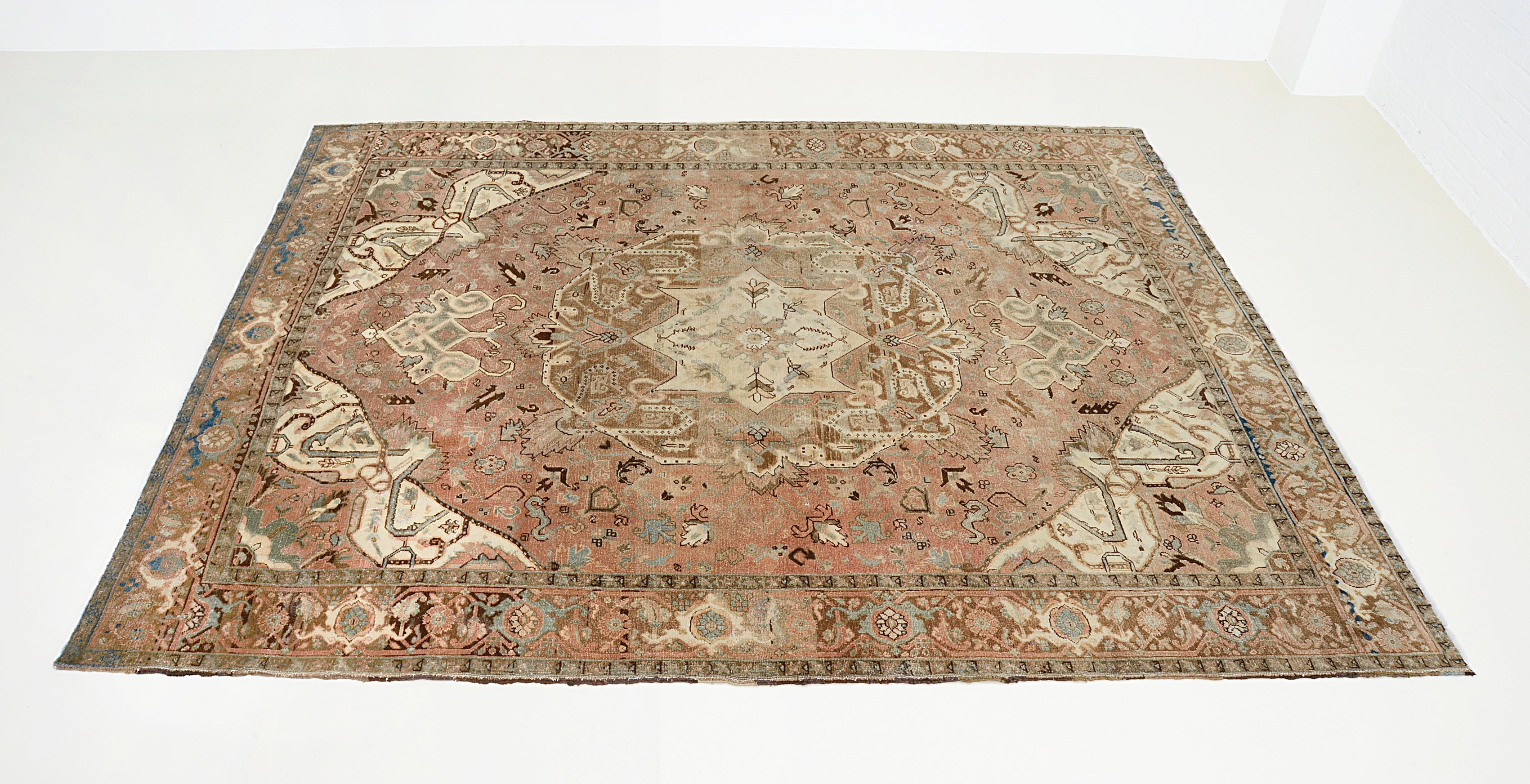 Hand-knotted vintage Persian Heriz carpet with central medallion and bold geometric design

