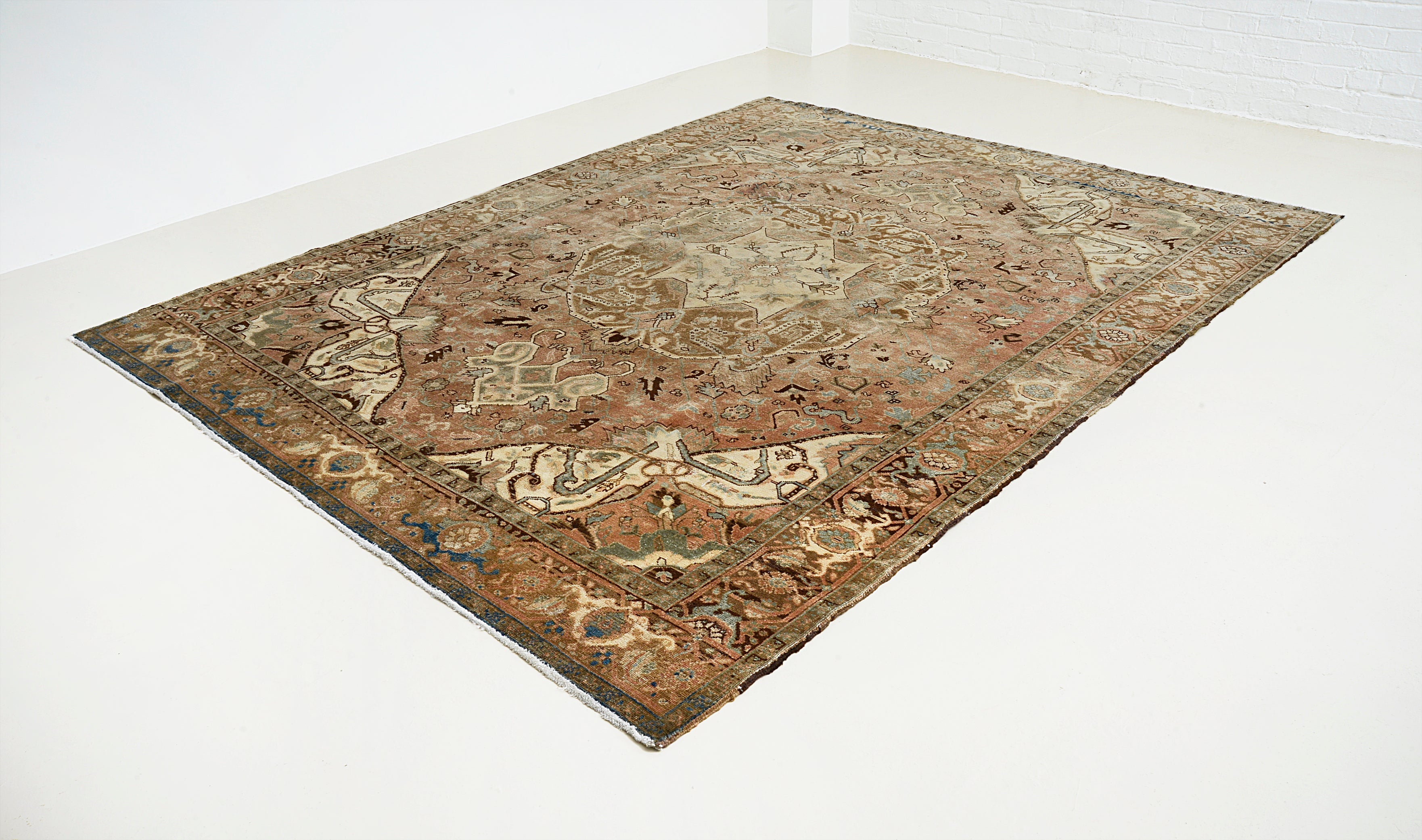 Medium-size vintage Heriz carpet from Persia featuring architectural pattern and aged tones
