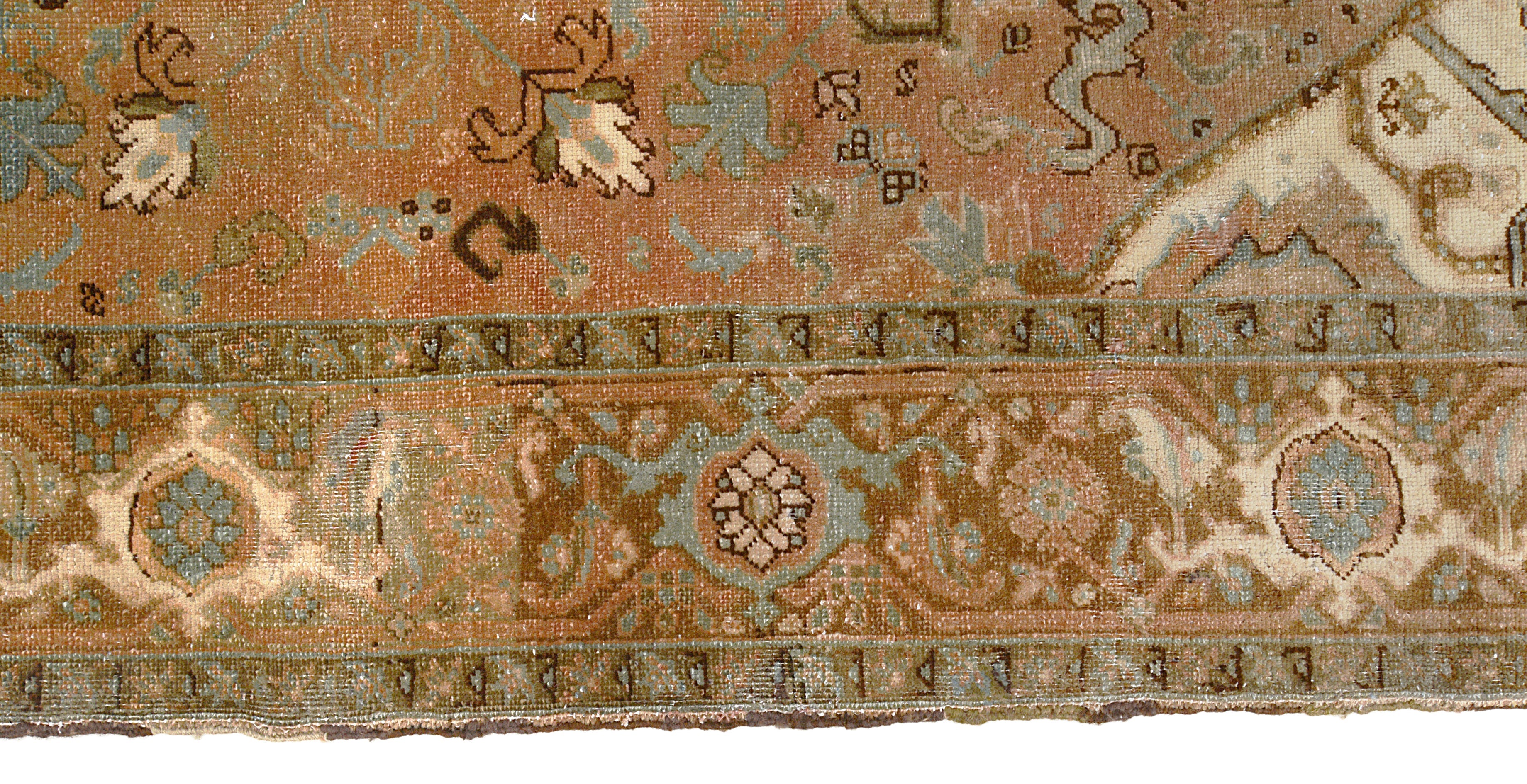 Close-up details of vintage Persian Heriz carpet showing wool texture, motifs, and natural patina
