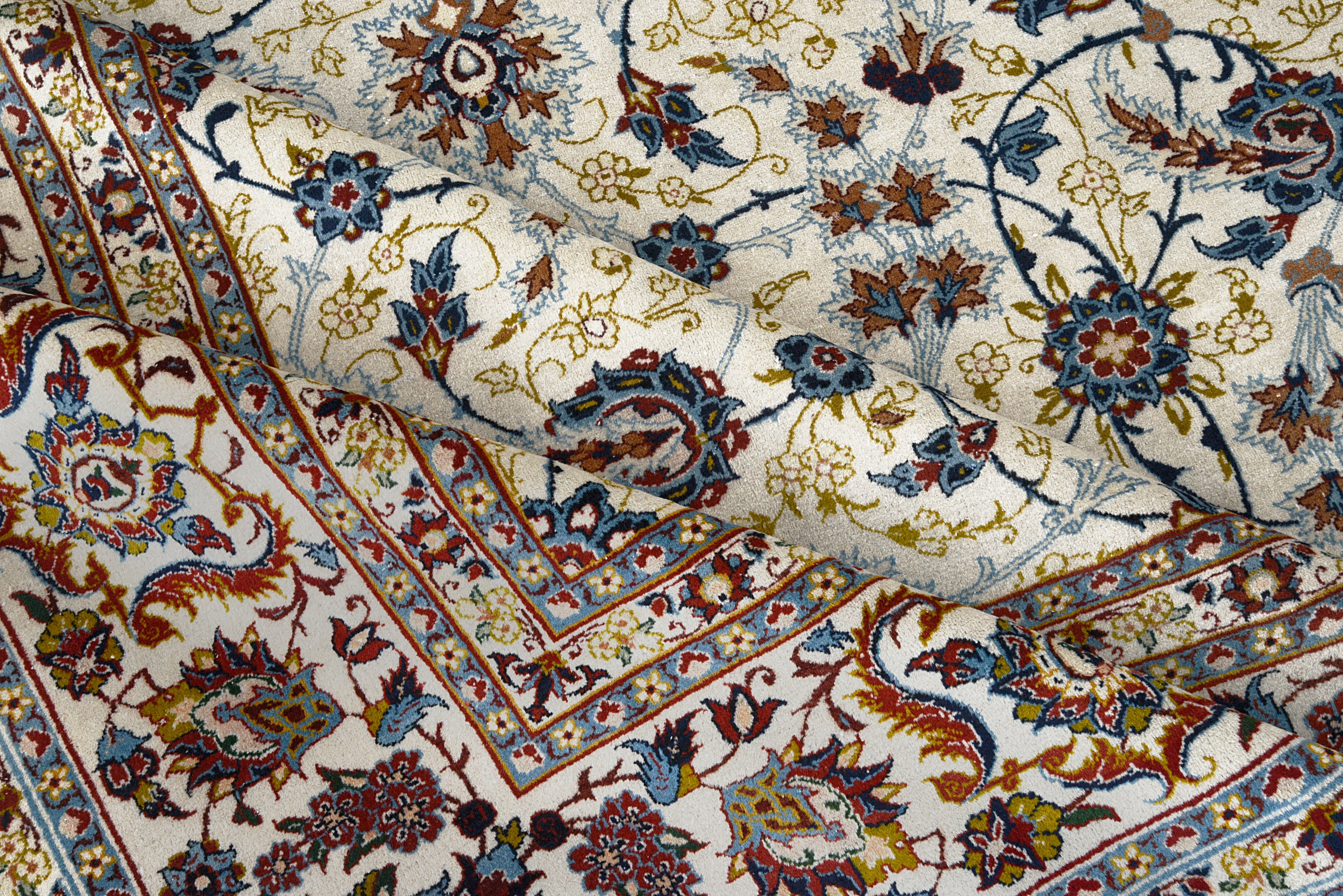 Close-up details of fine antique Persian Kashan rug showing silk warp fringes, wool texture, and aged patina
