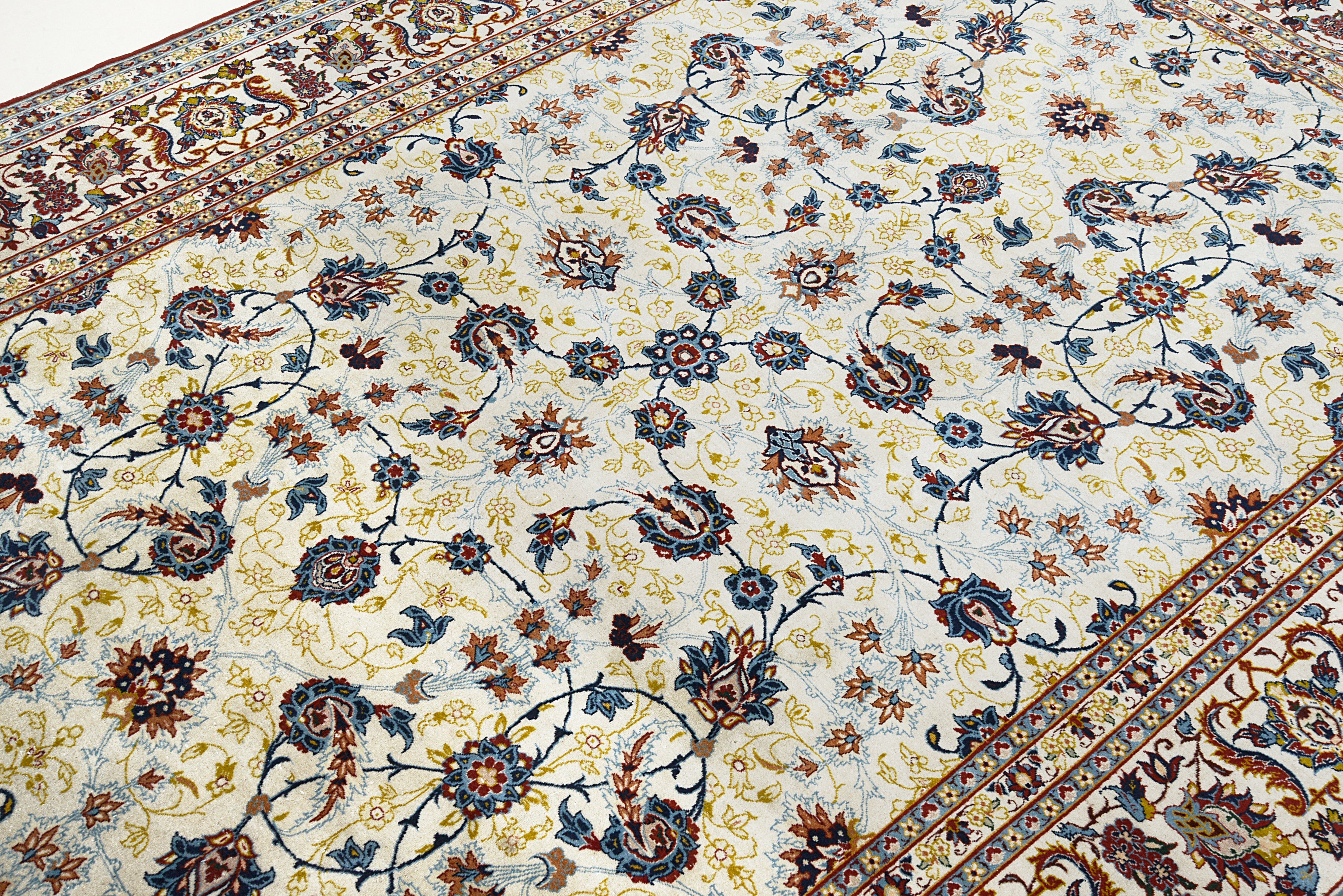 Close-up details of fine antique Persian Kashan rug showing silk warp fringes, wool texture, and aged patina
