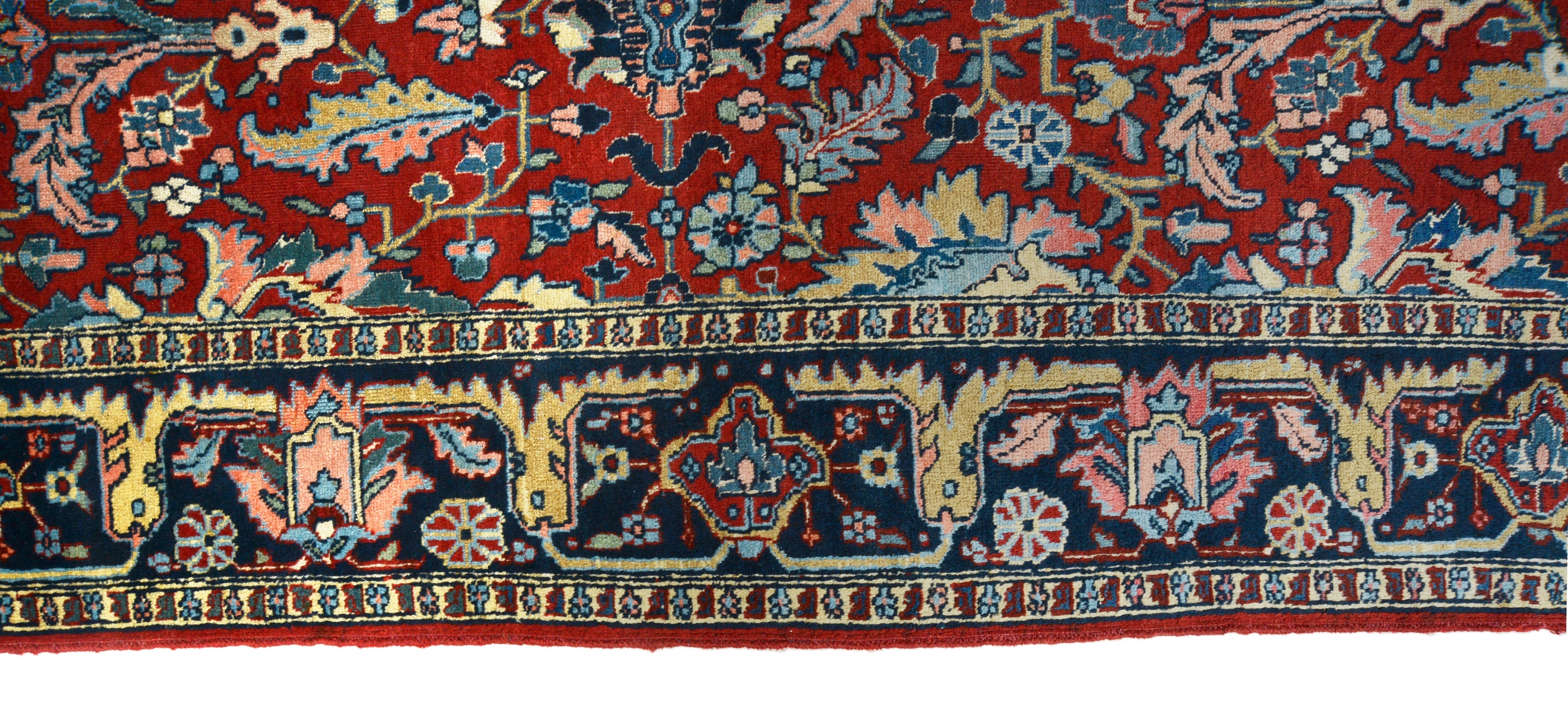 Close-up details of antique Persian Heriz carpet showing wool texture, motifs, and natural patina
