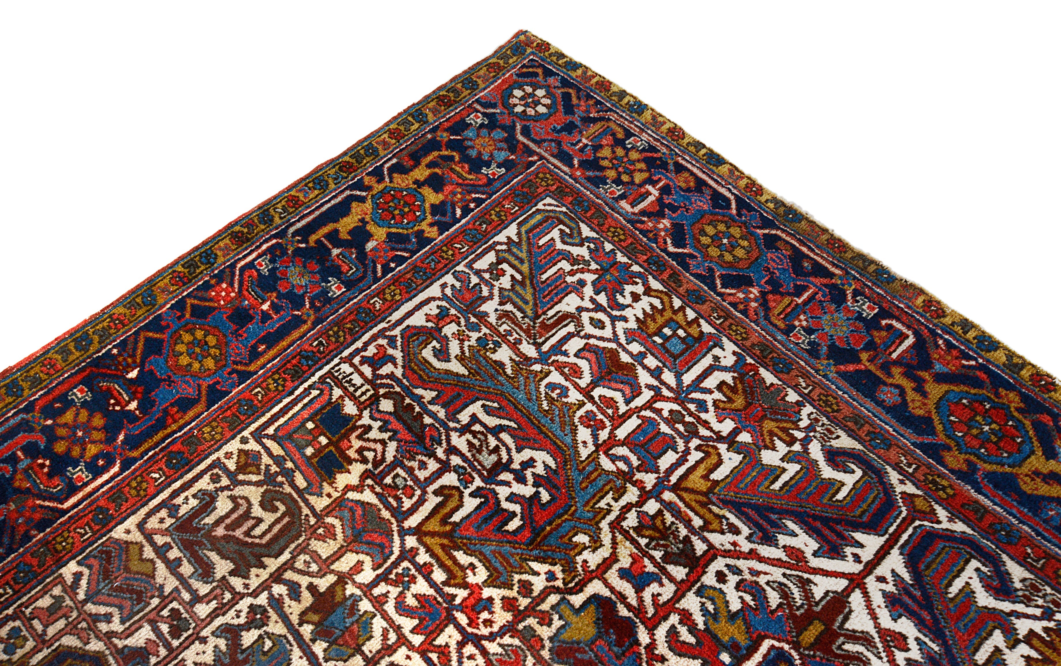 Close-up details of vintage Heriz carpet showing wool texture, motifs, and natural patina

