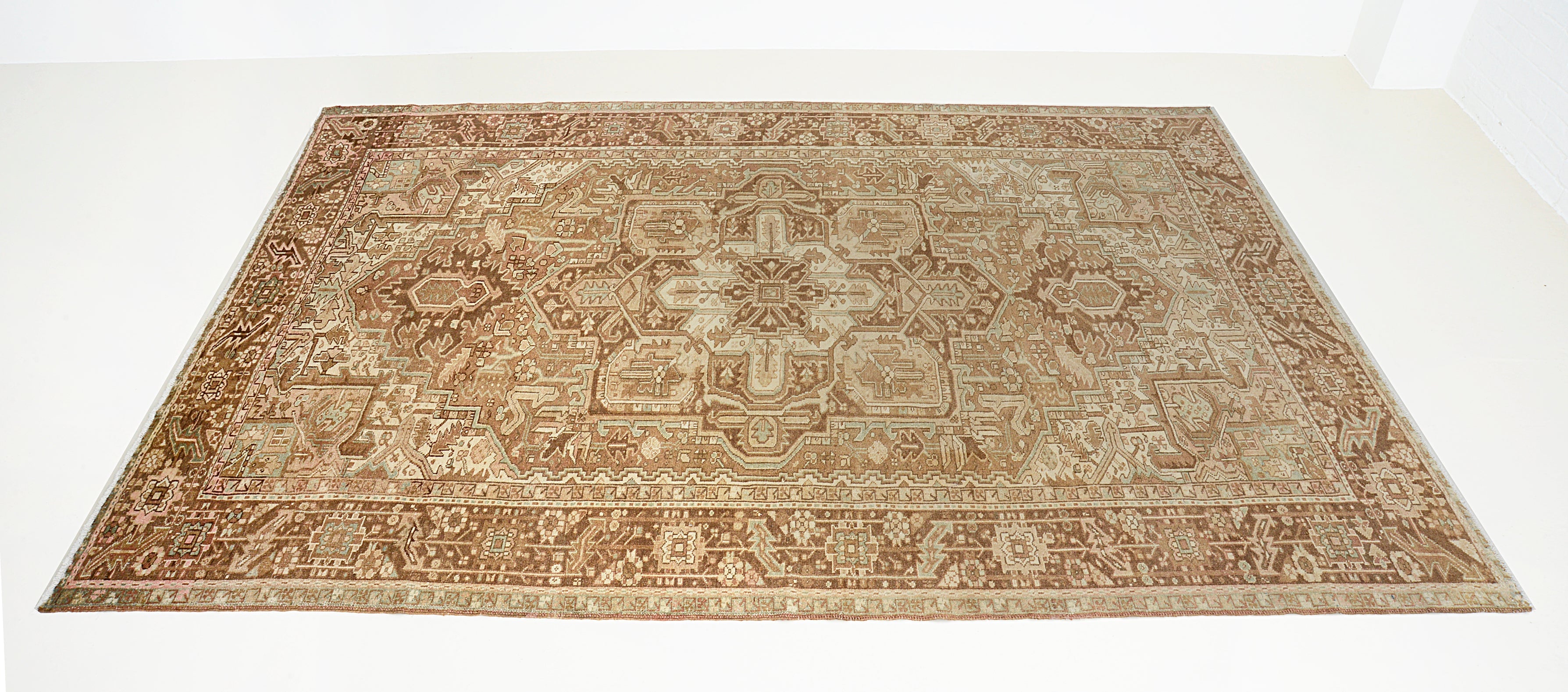 Hand-knotted vintage Heriz carpet with architectural geometric design and aged tones
