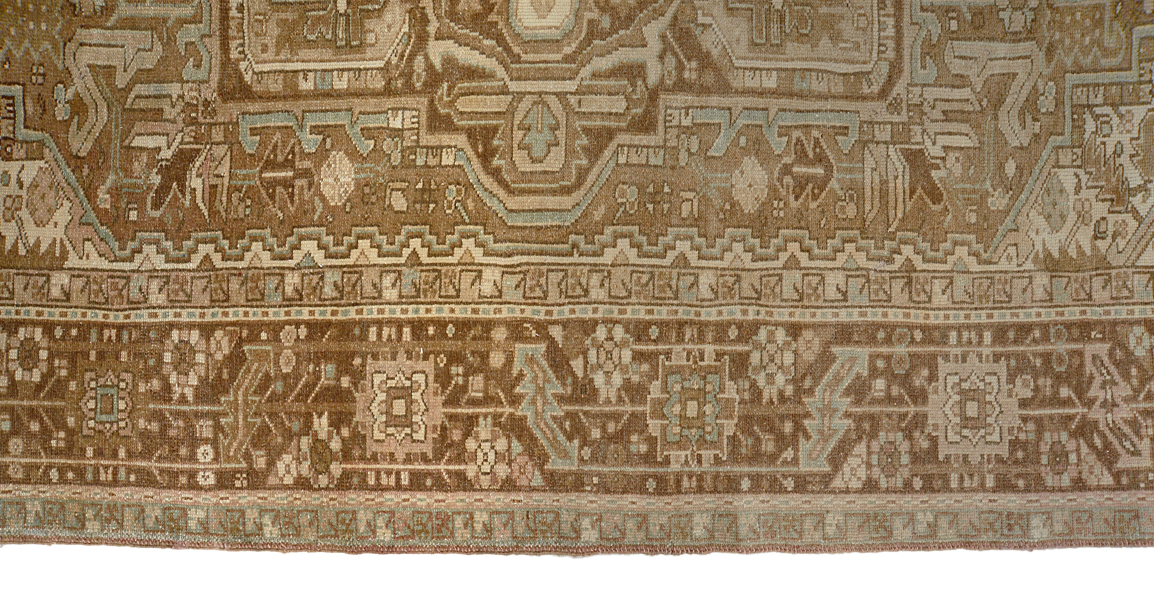 Close-up details of vintage Persian Heriz carpet showing wool texture, motifs, and natural patina
