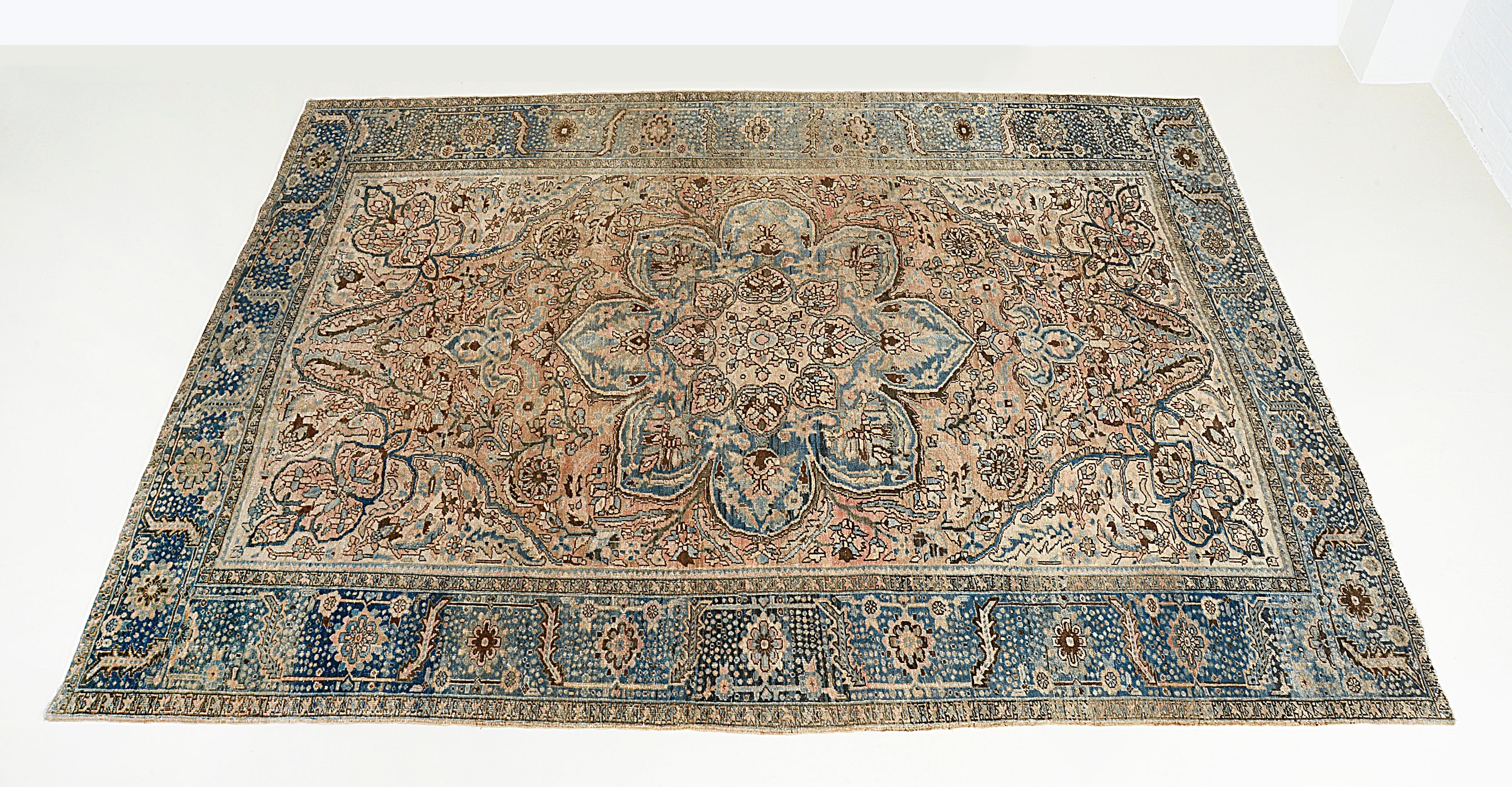 Hand-knotted vintage Persian Heriz carpet with central medallion and bold geometric design

