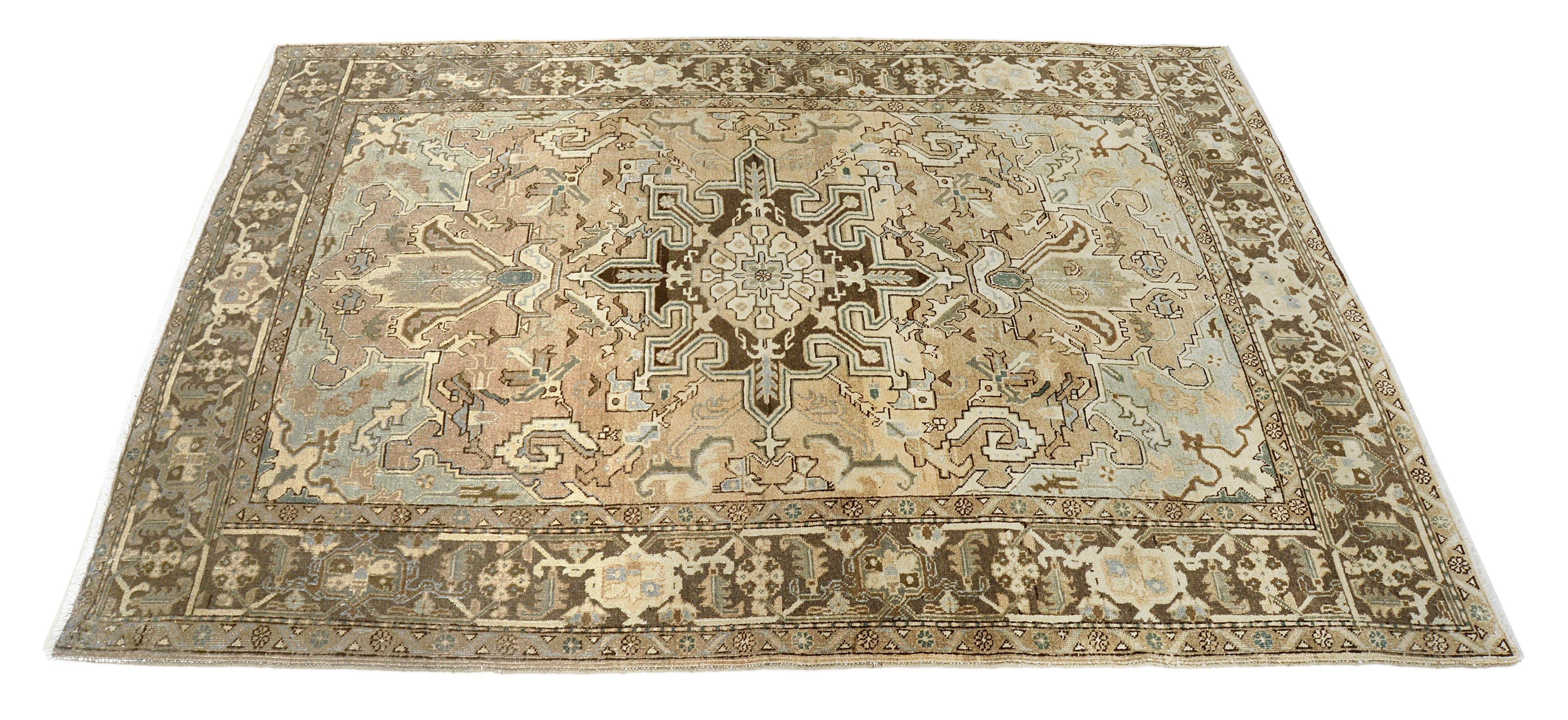 Hand-knotted vintage Heriz rug with central medallion and architectural geometric design
