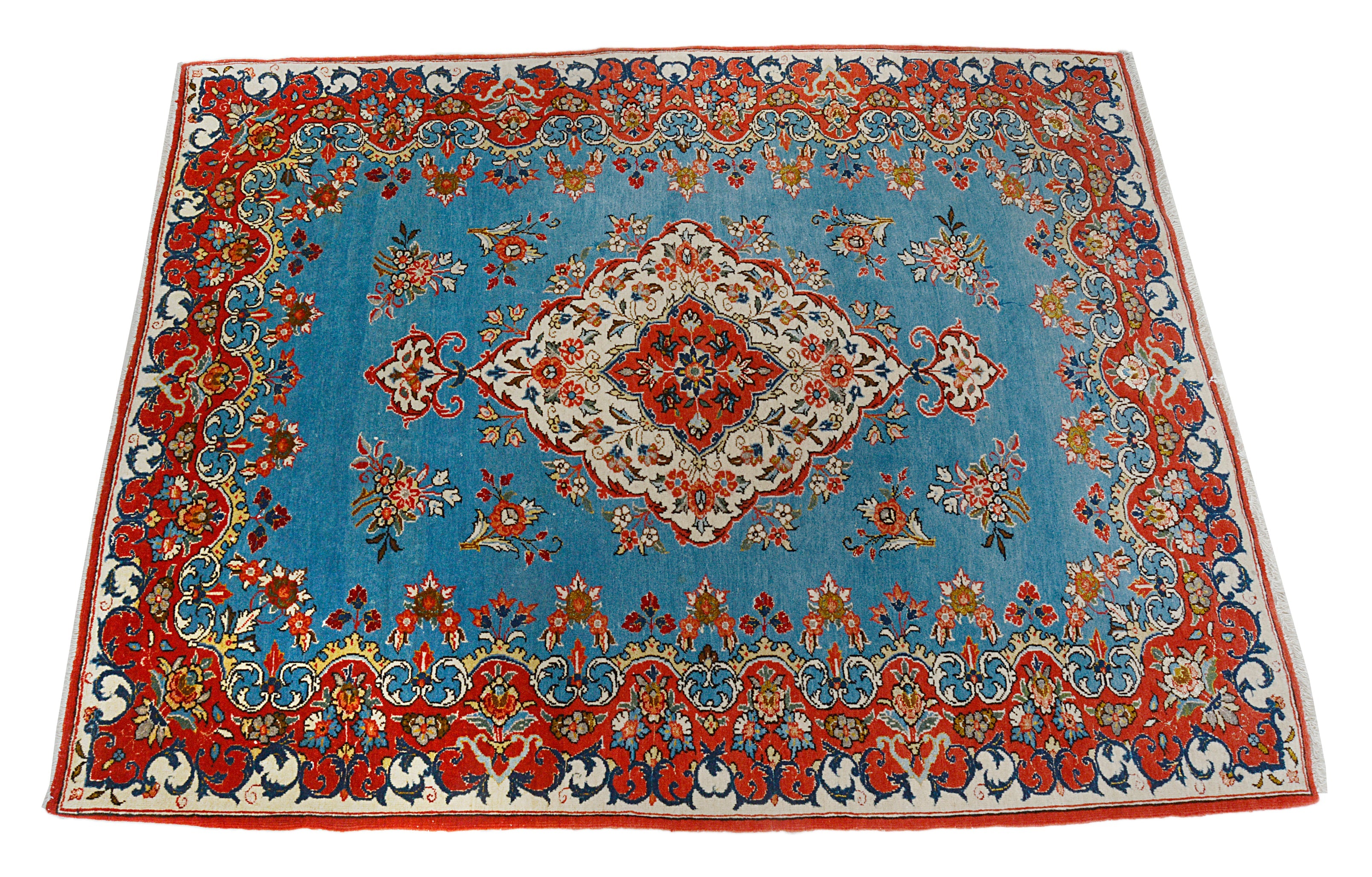 Hand-knotted antique Persian Qom rug with central medallion and blue field
