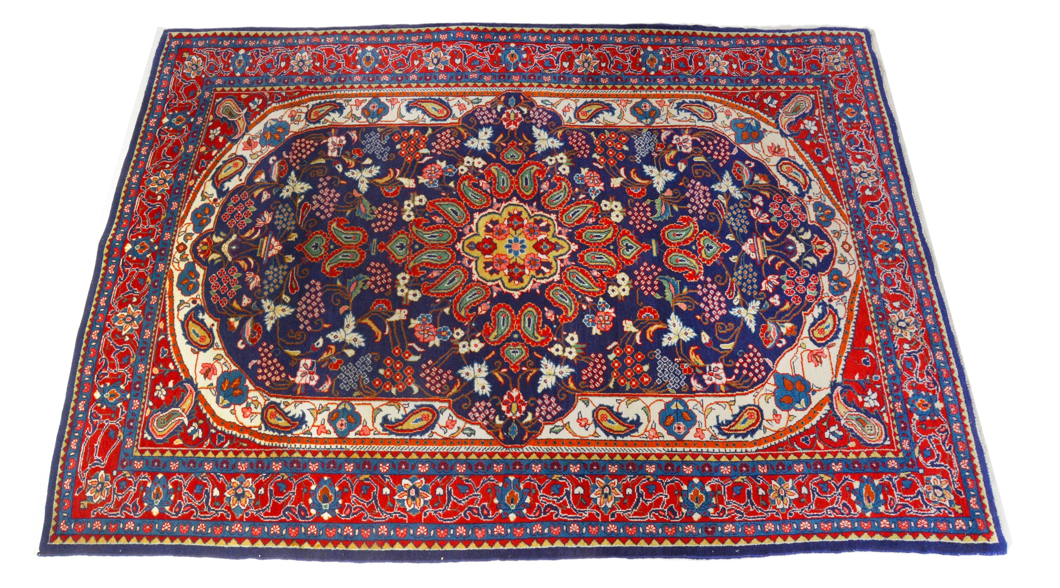 Hand-knotted vintage Sarouk rug with central medallion and rich navy blue field
