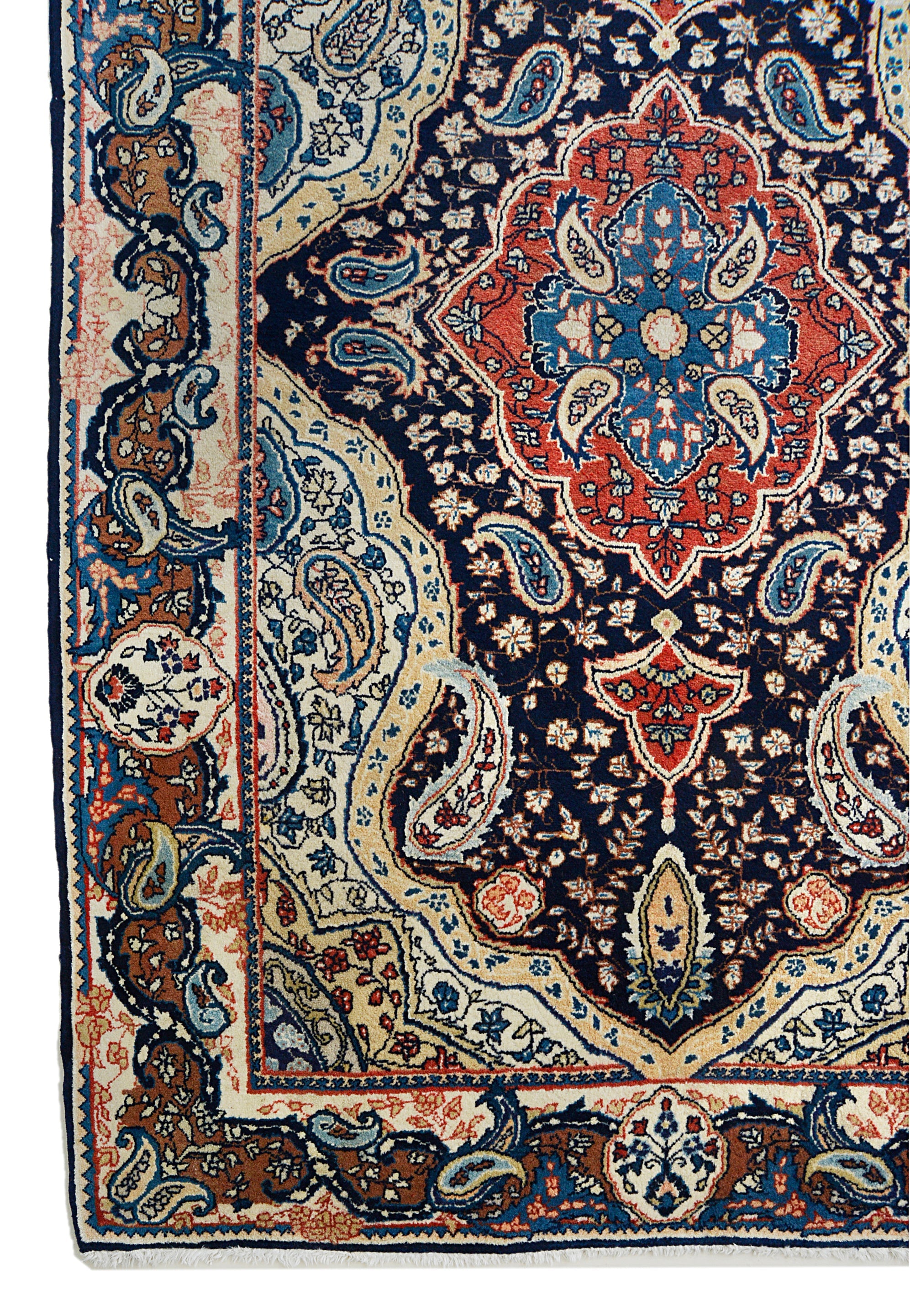 Fine antique Persian Sarouk rug corner detail showing hand-knotted wool and floral border
