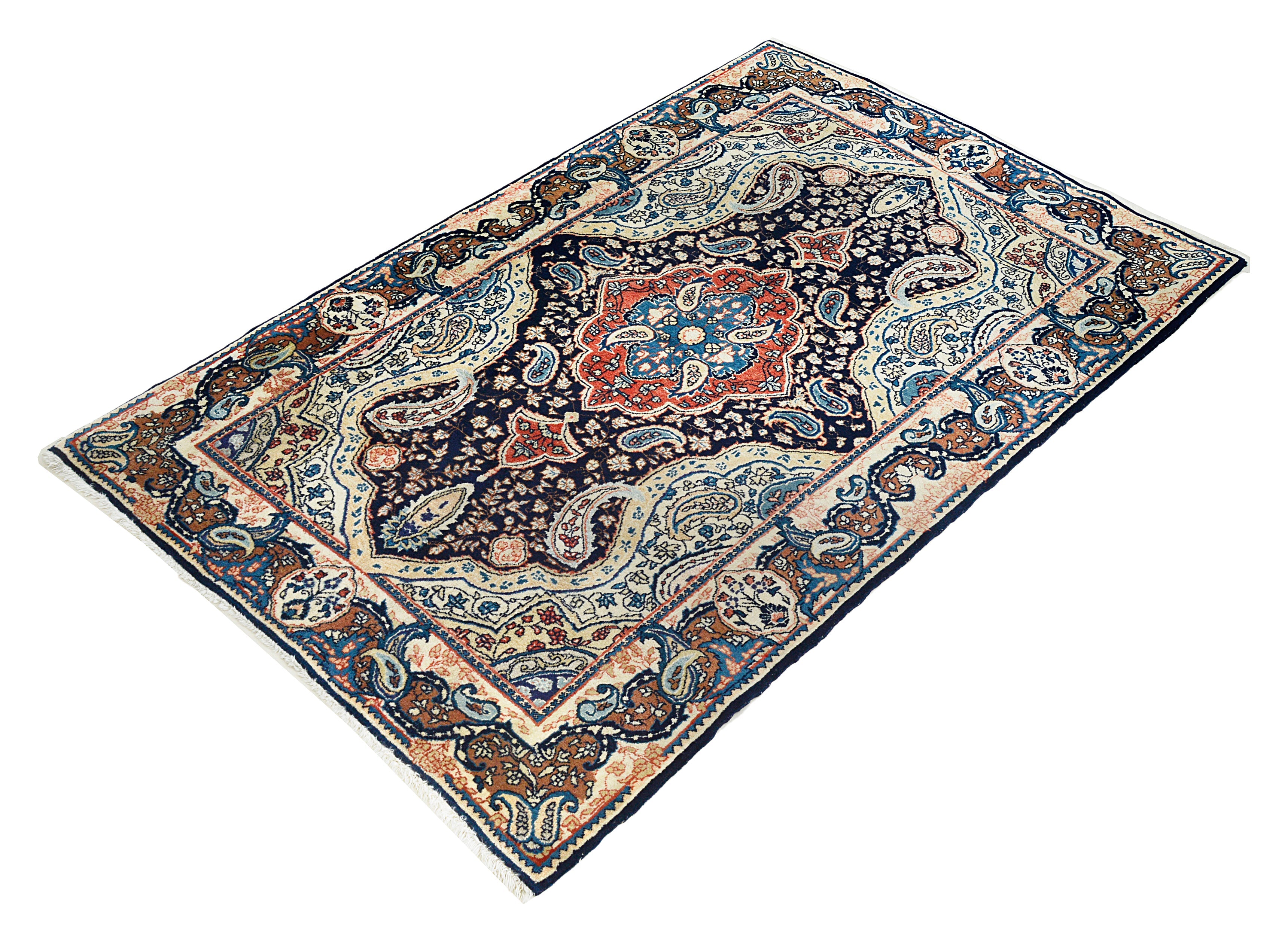 Small antique Persian Sarouk rug featuring elegant floral design and rich colours
