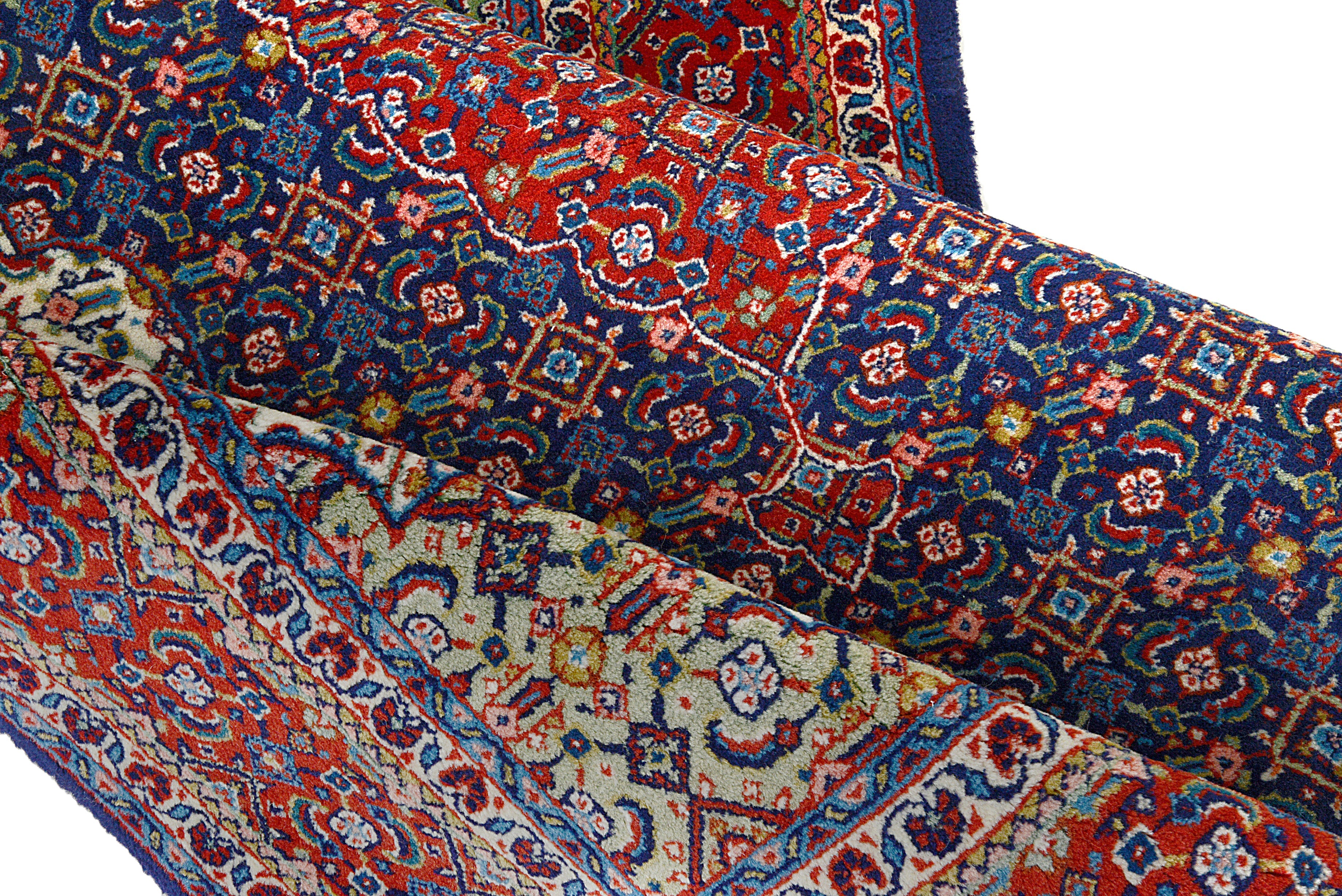 Close-up details of vintage Persian Sarouk rug showing wool texture, motifs, and natural patina
