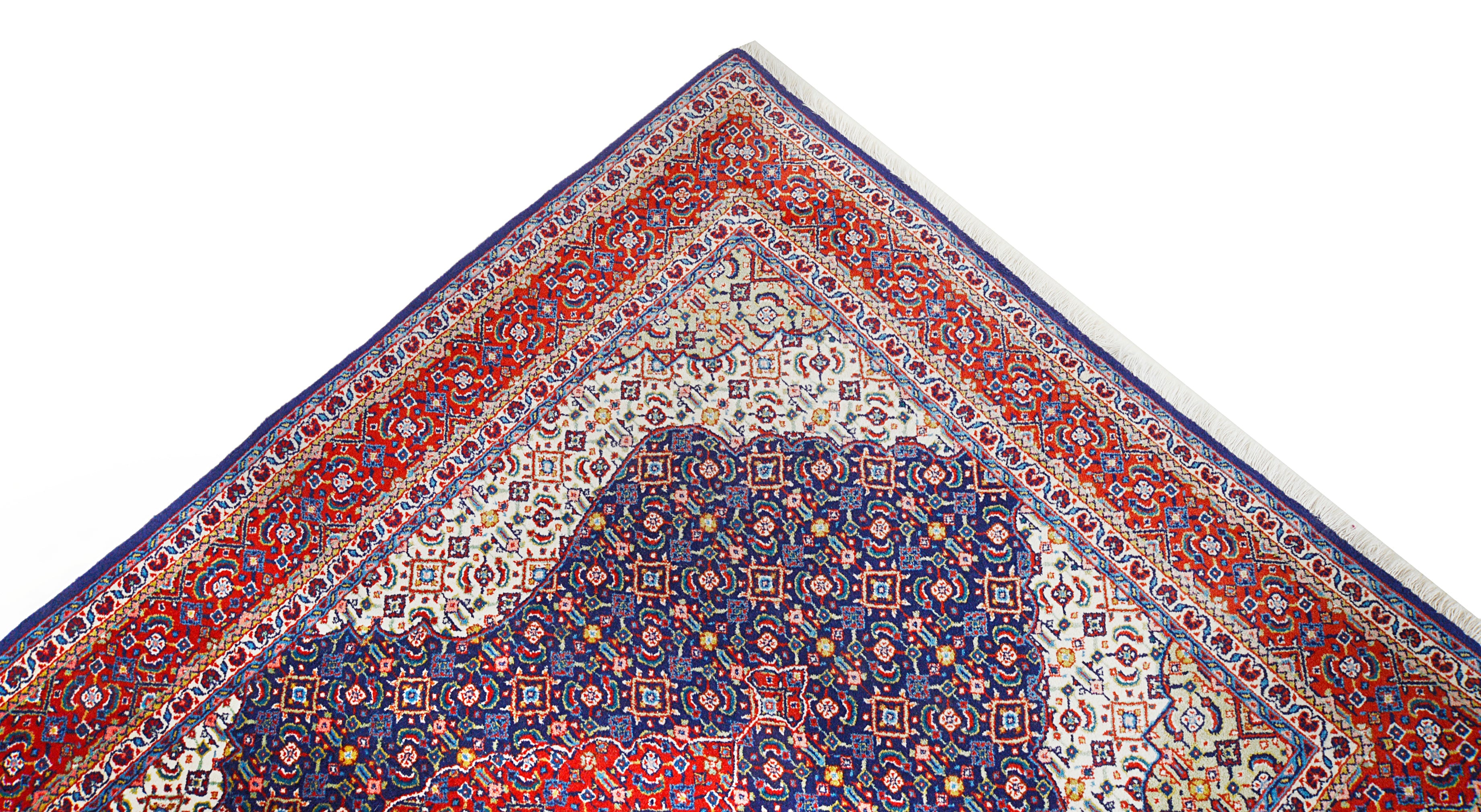 Close-up details of vintage Persian Sarouk rug showing wool texture, motifs, and natural patina
